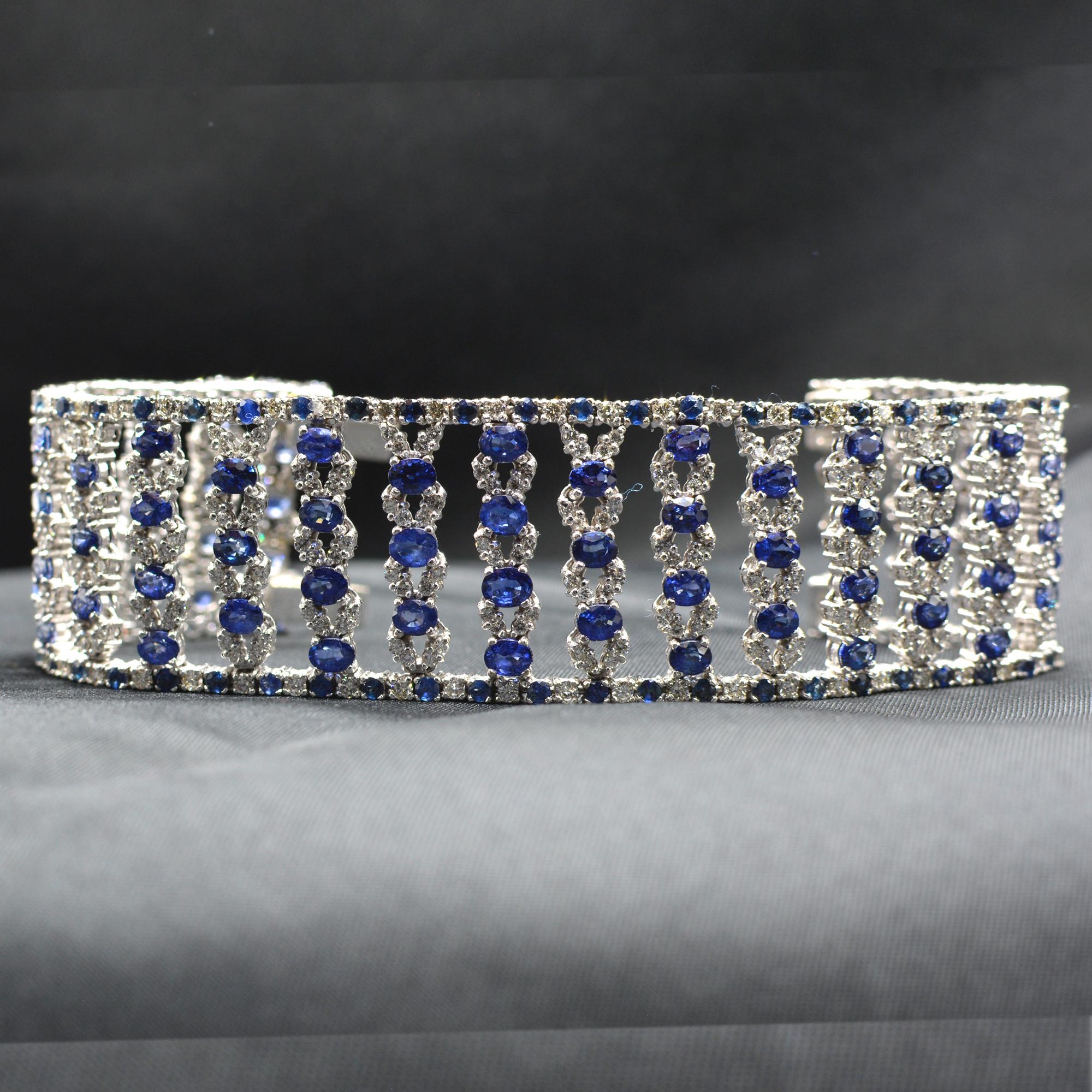 Very wide Blue sapphire and Diamonds Bracelet
oval shape AAA Quality Sapphires Total of 27.50 carat.
(each sapphire is approx 3 x 4 mm)
Diamonds total of 4.0 carat  GH-VS.
14K White Gold 55.0 Grams.
Lenght 7' Inch.
Bracelet width is approx 27 mm

