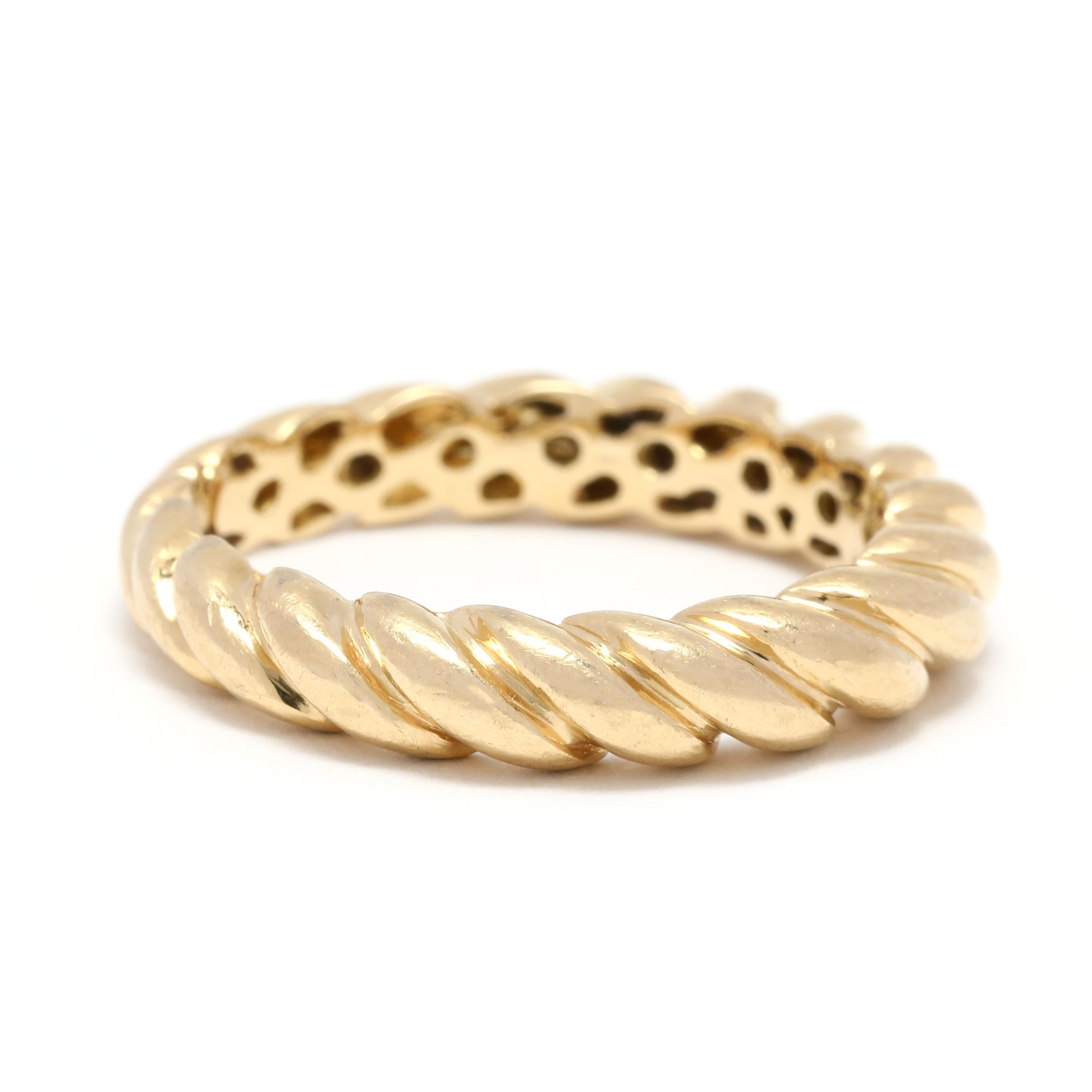 This stunning Wide Cable Twist Wedding Band is crafted in 18K Yellow Gold, giving it a rich and luxurious feel. With a classic rope design, this simple stackable band is perfect for the modern bride. This ring is a size 6.5, and is sure to make a