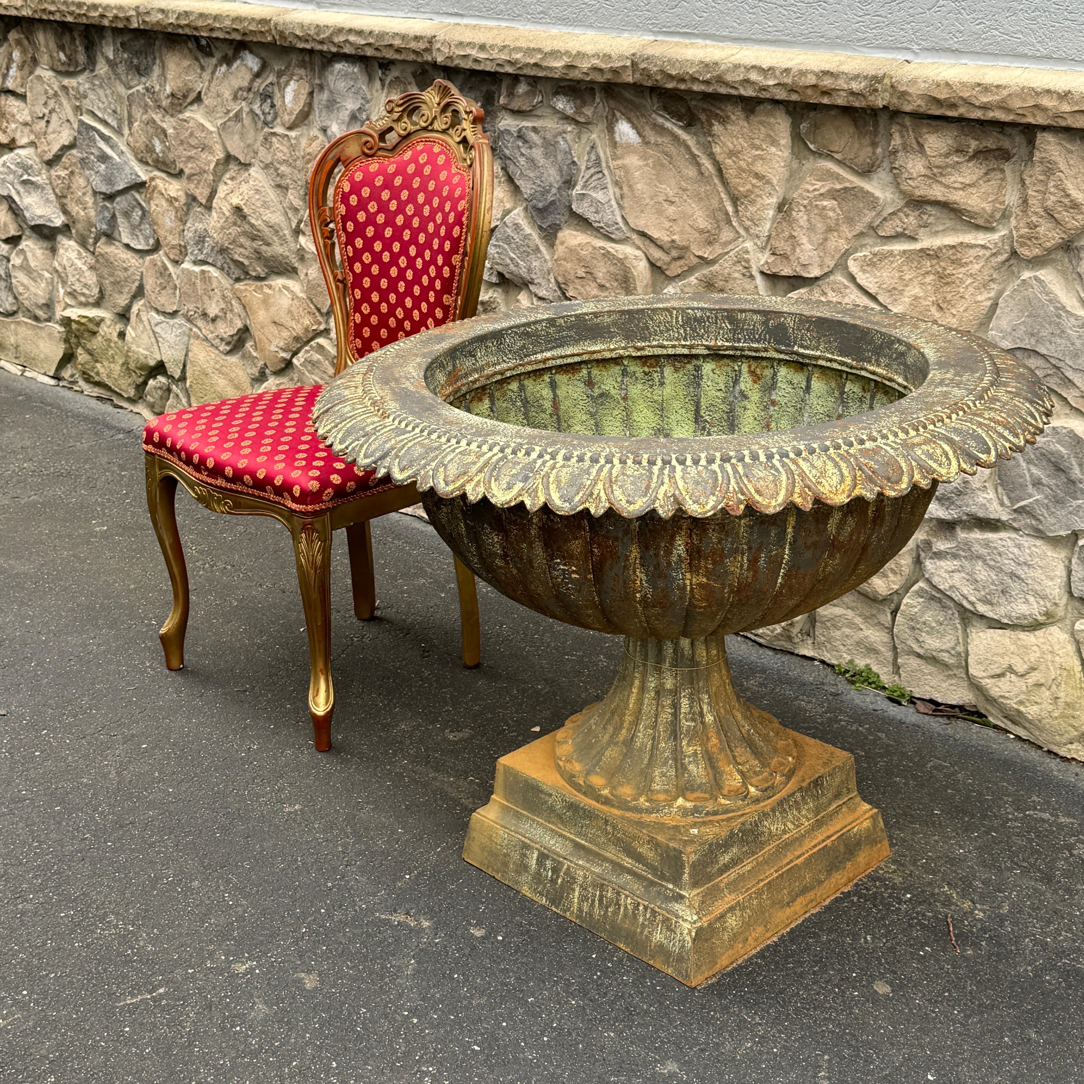 Unusual Large Round Cast Iron Planter. This is a heavy and very large is size, so please see all listed image to gage the size. This would be a charming addition for the garden or any interior patio as this urn certainly will add personality to any