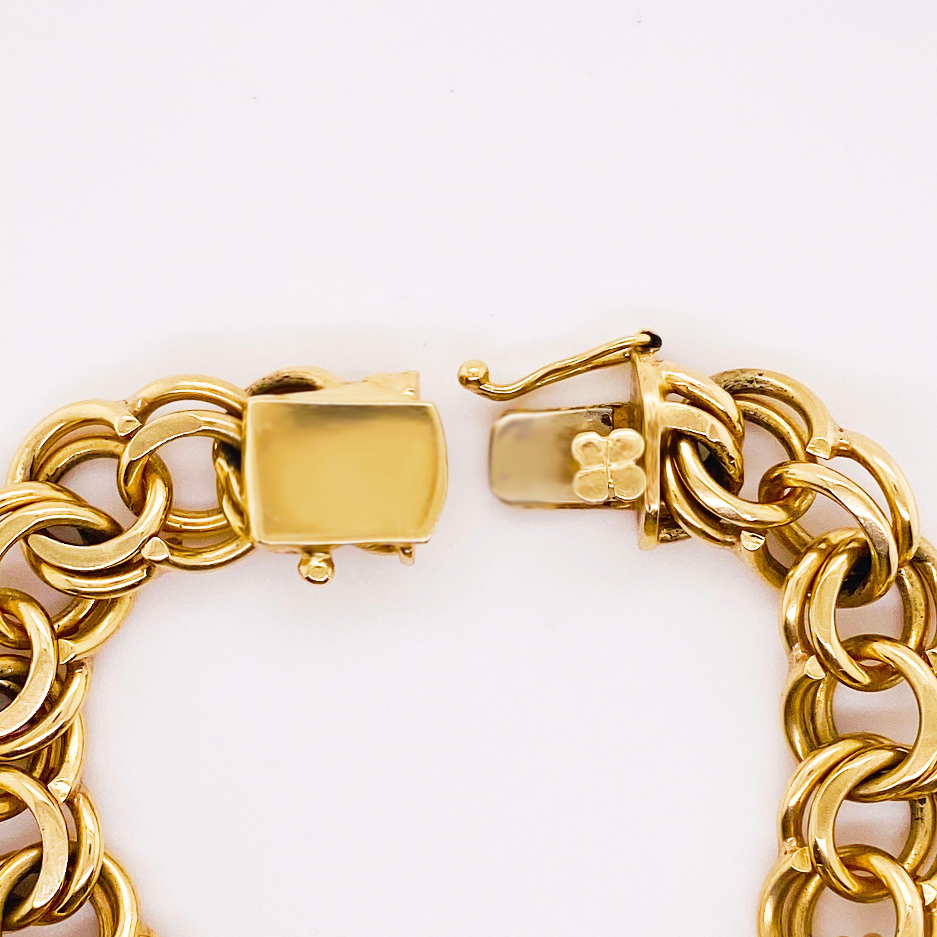This 14 karat yellow gold charm bracelet is so RETRO!  It is one of the widest that I have ever seen at 12 milometers!  Originating from Rhode Island, this charm bracelet was designs so that you can wear the extra large charms on it! These are the