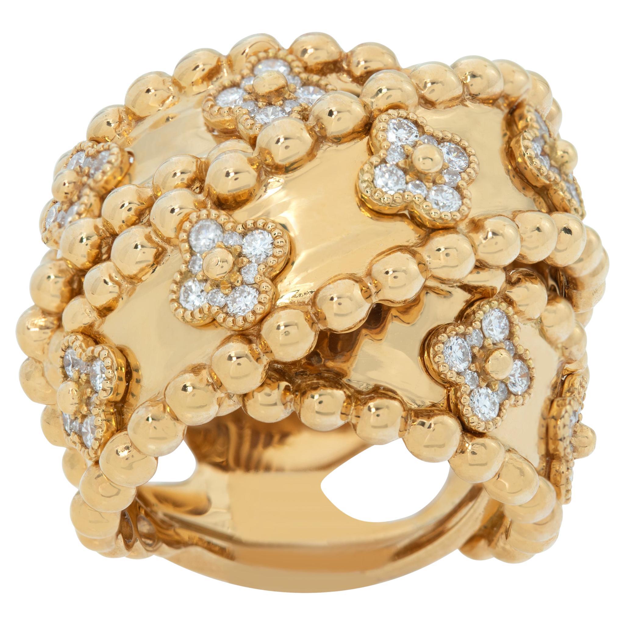 Wide crossover ring w/ "Alhambra" style design diamond stations in yellow gold For Sale