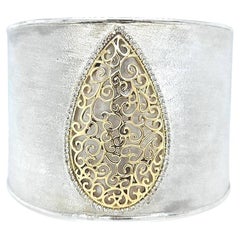 Wide Diamond Accented Cuff Featuring 14 Karat Yellow Gold