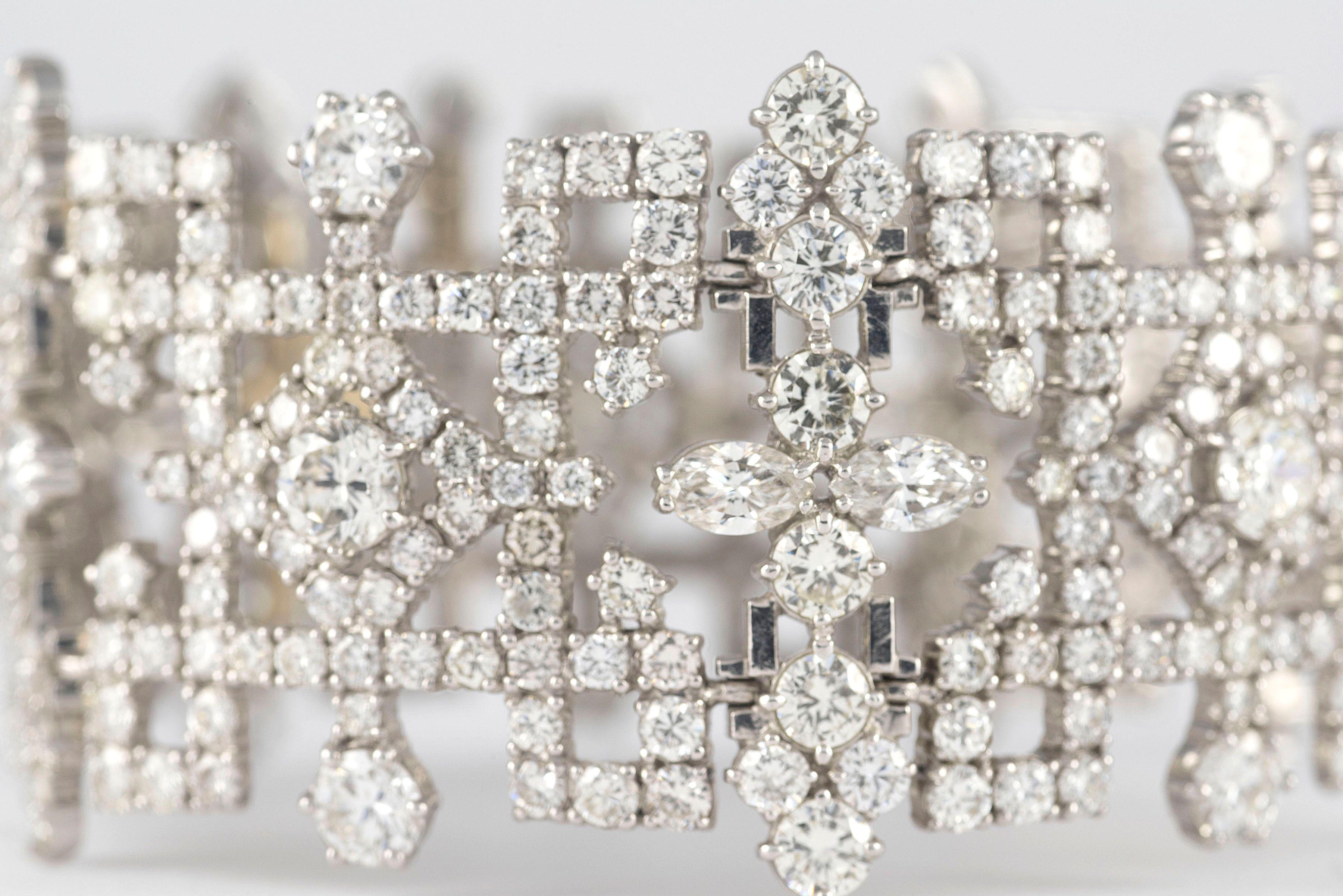 This magnificent Art Deco-style bracelet features approximately 50.0 carats of round and marquise diamonds embellished over alternating geometric links hand crafted in platinum. 
