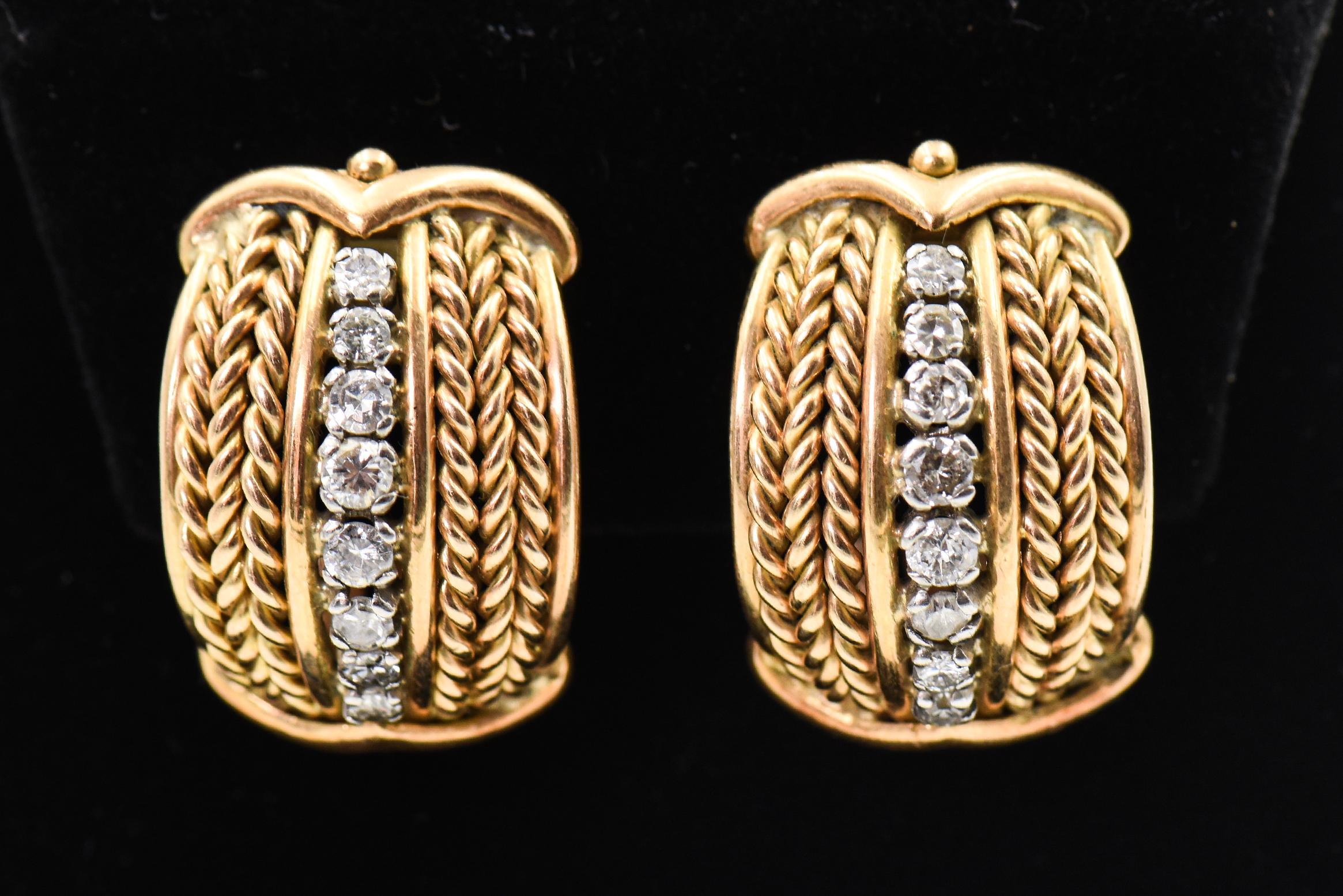1970s Highly stylized hoop earrings with woven sections on either side of a graduated diamond line down the center.  The top and bottom have a stylized arrow.  These 18k yellow gold earrings have a clip back so you do not need pierced ears to where