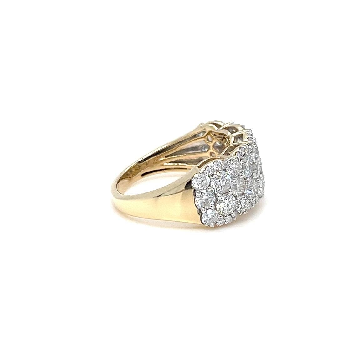 14 karat yellow gold ring featuring 58 round brilliant cut diamonds of SI clarity and H color totaling approximately 3.00 carats. 9.55mm wide white gold accented top with tapered back. Finger size 7.25. Includes one sizing service upon request,