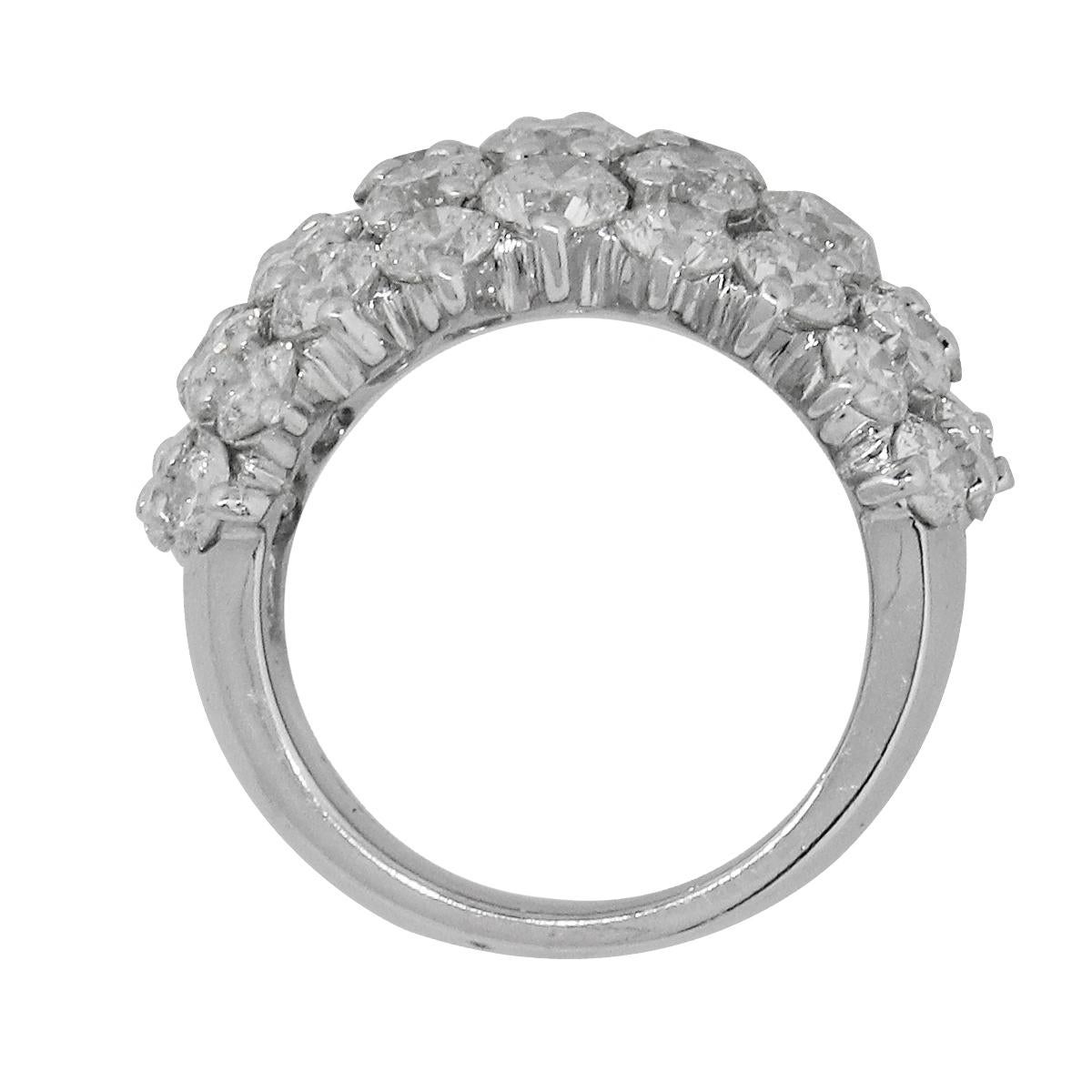 Material: 14k White Gold
Diamond Details: Total of 45 Diamonds. Approximately 7.17ctw of round brilliant diamonds. Diamonds are G/H in color and VS in clarity
Ring Size: 6.5
Ring Measurements: 0.96″ x 0.78″ x 0.96″
Total Weight: 16.7g (10.7dwt)
SKU: