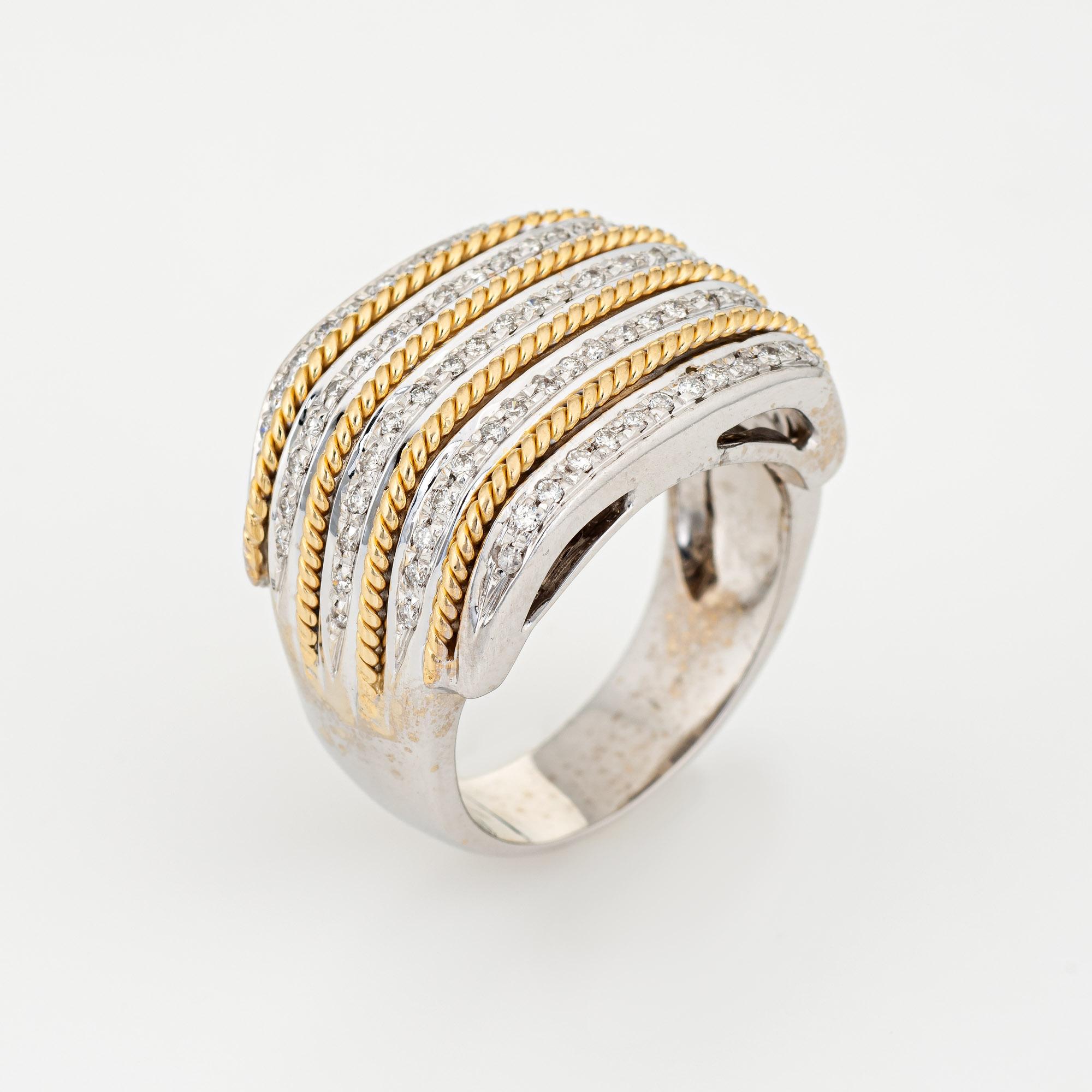 Stylish vintage diamond wide band (circa 1990s) crafted in two-tone 18 karat white & yellow gold. 

85 round brilliant cut diamonds total an estimated 0.42 carats (estimated at I-J color and SI1-2 clarity). 

The wide band (17mm - 0.66 inches) is