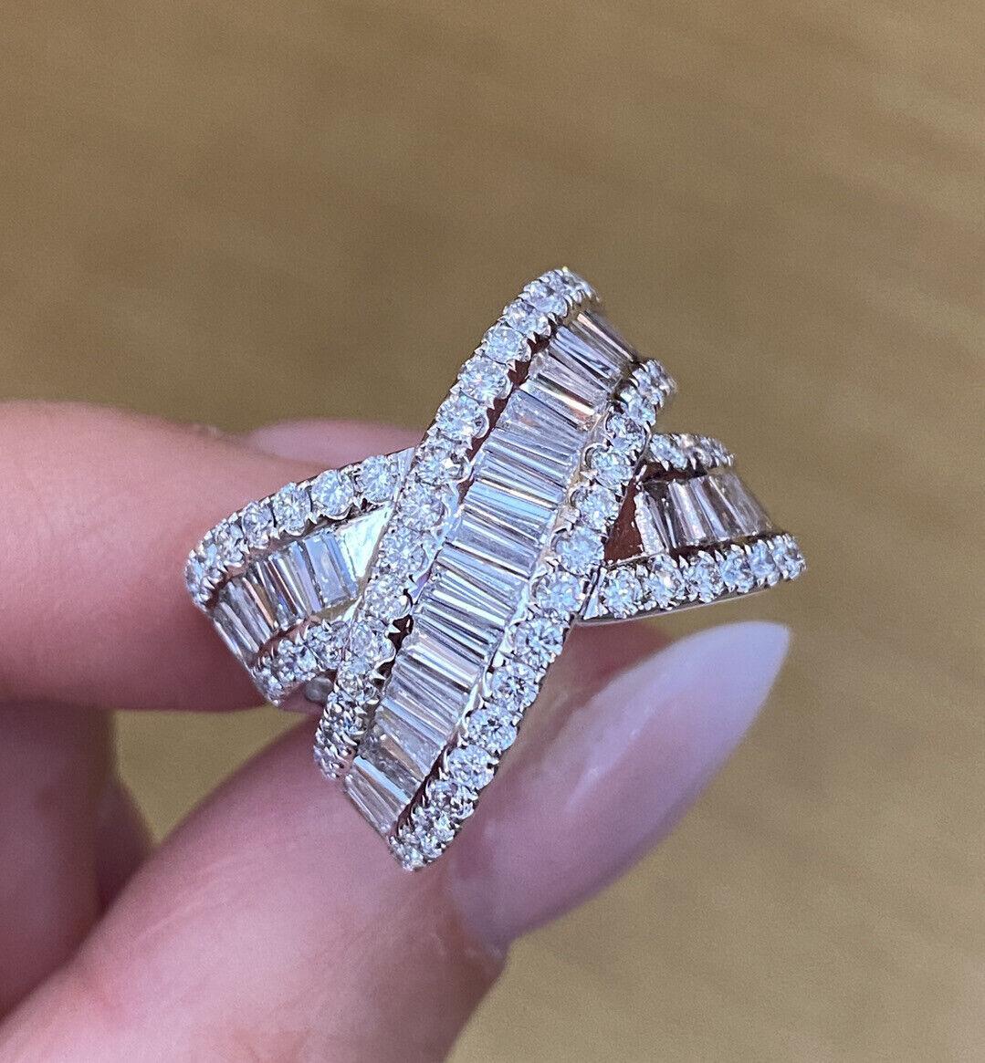 Wide Diamond Crossover Ring 3.48 Carat Total Weight in 18k White Gold

Diamond Crossover Ring features Tapered Baguette Diamonds and Round Brilliant Diamonds set in two bands that cross over each other set in 18k White Gold.

Baguette Diamonds weigh