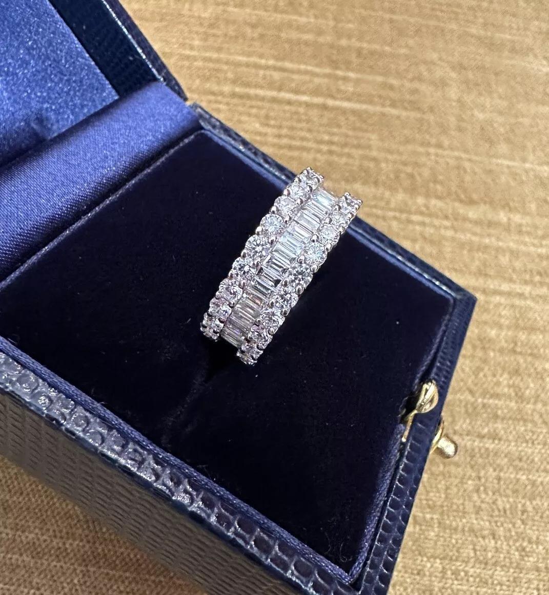 Wide Diamond Eternity Band Ring 3.50 carat total weight in 18k White Gold Size 7

Natural Diamond Eternity Band features two outer rows of Natural Round Brilliant Diamonds and one inner row of Natural Baguette Diamonds totaling approximately 3.50