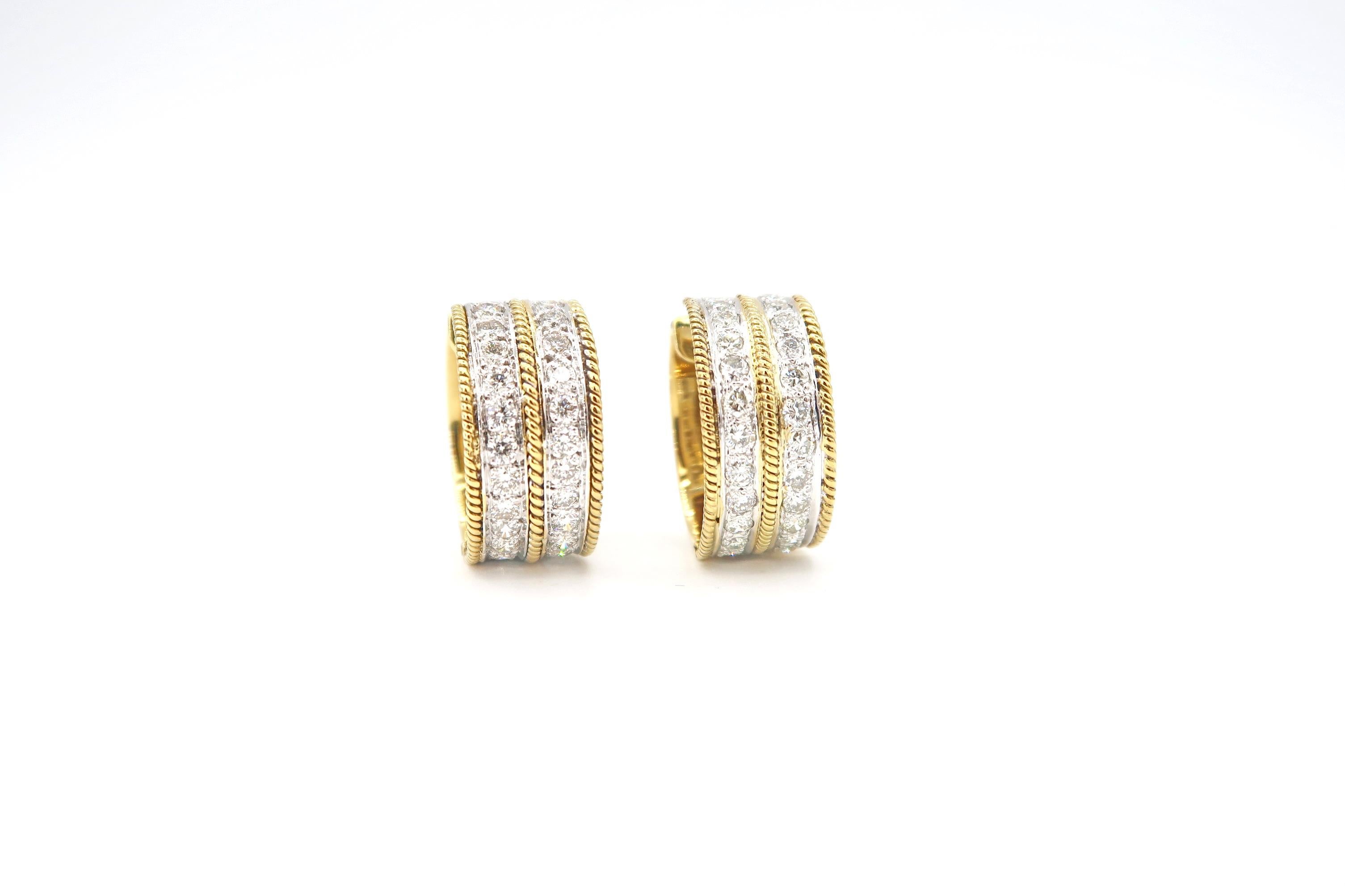 Wide Double Stripe Diamond Huggie Earrings with Milgrain Detail in 14K Gold

Gold: 14K Gold, 16.083 g
Diamond: 2.18 ct

Width: 10mm
Diameter: 21mm
