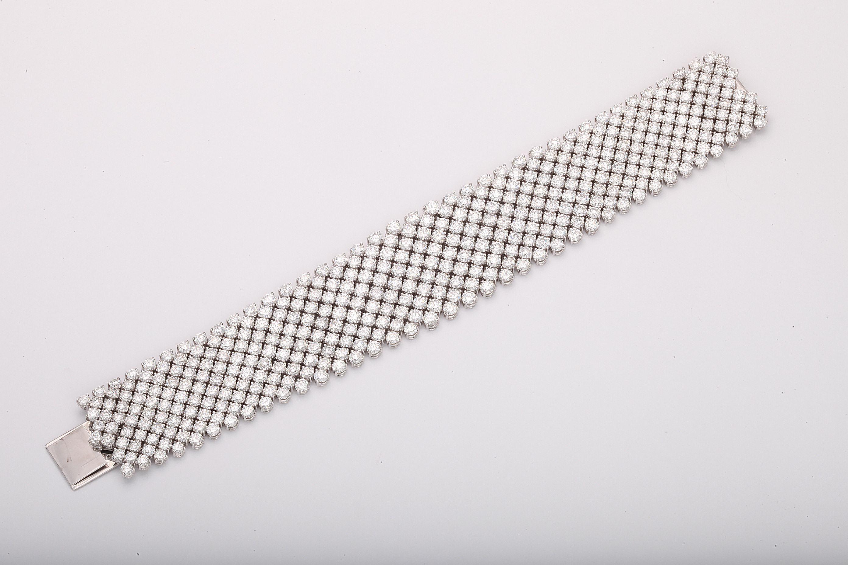 This is simply the finest, and most flexible, wide diamond bracelet that you will ever encounter.  Each of the 374 perfectly cut, and perfectly matched, round diamonds is set in it's own four prong setting, all of which are then perfectly linked