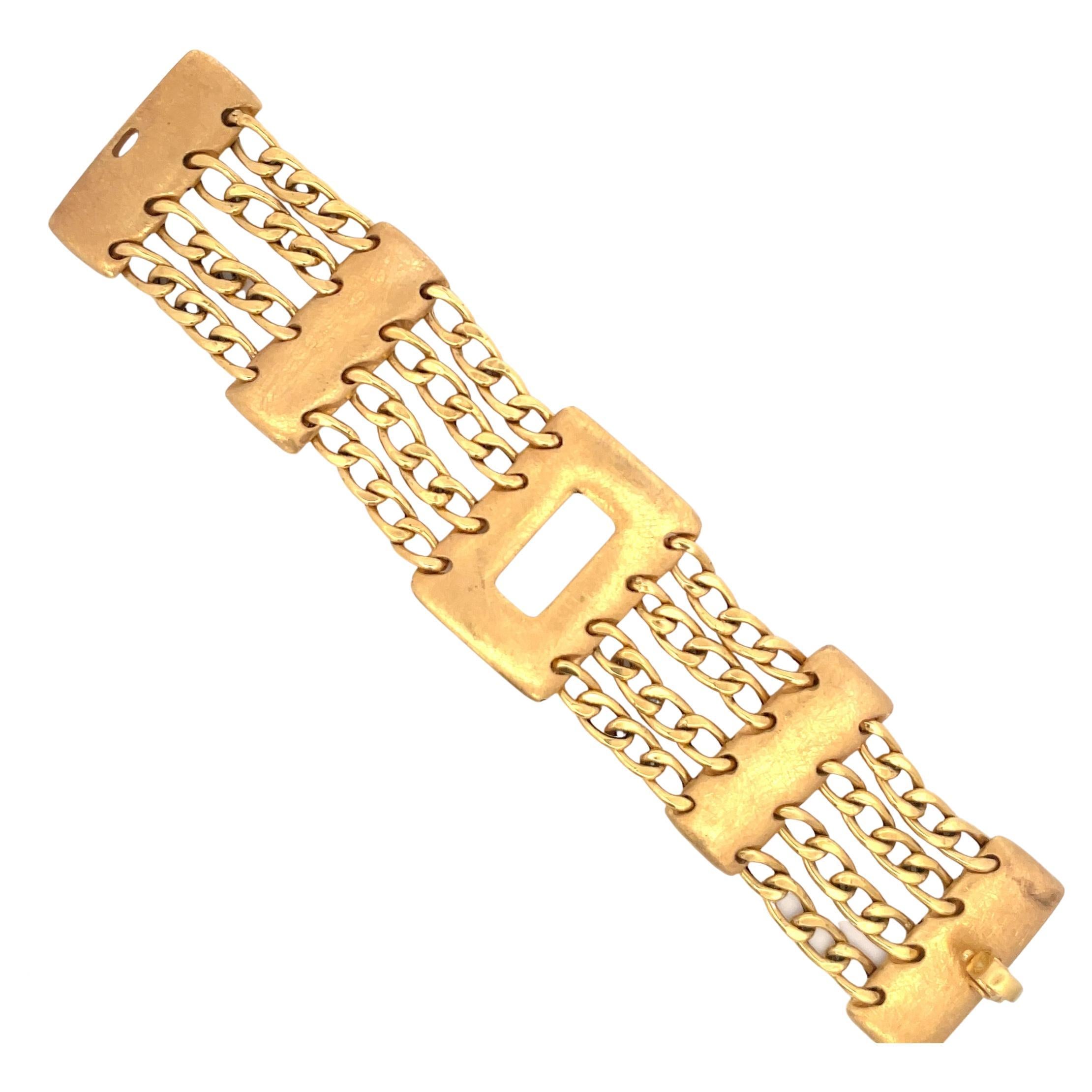 Wide link bracelet featuring four rows of Cuban links separated with brushed bars weighing 33.9 grams. 
More links available
Search Harbor Diamonds
