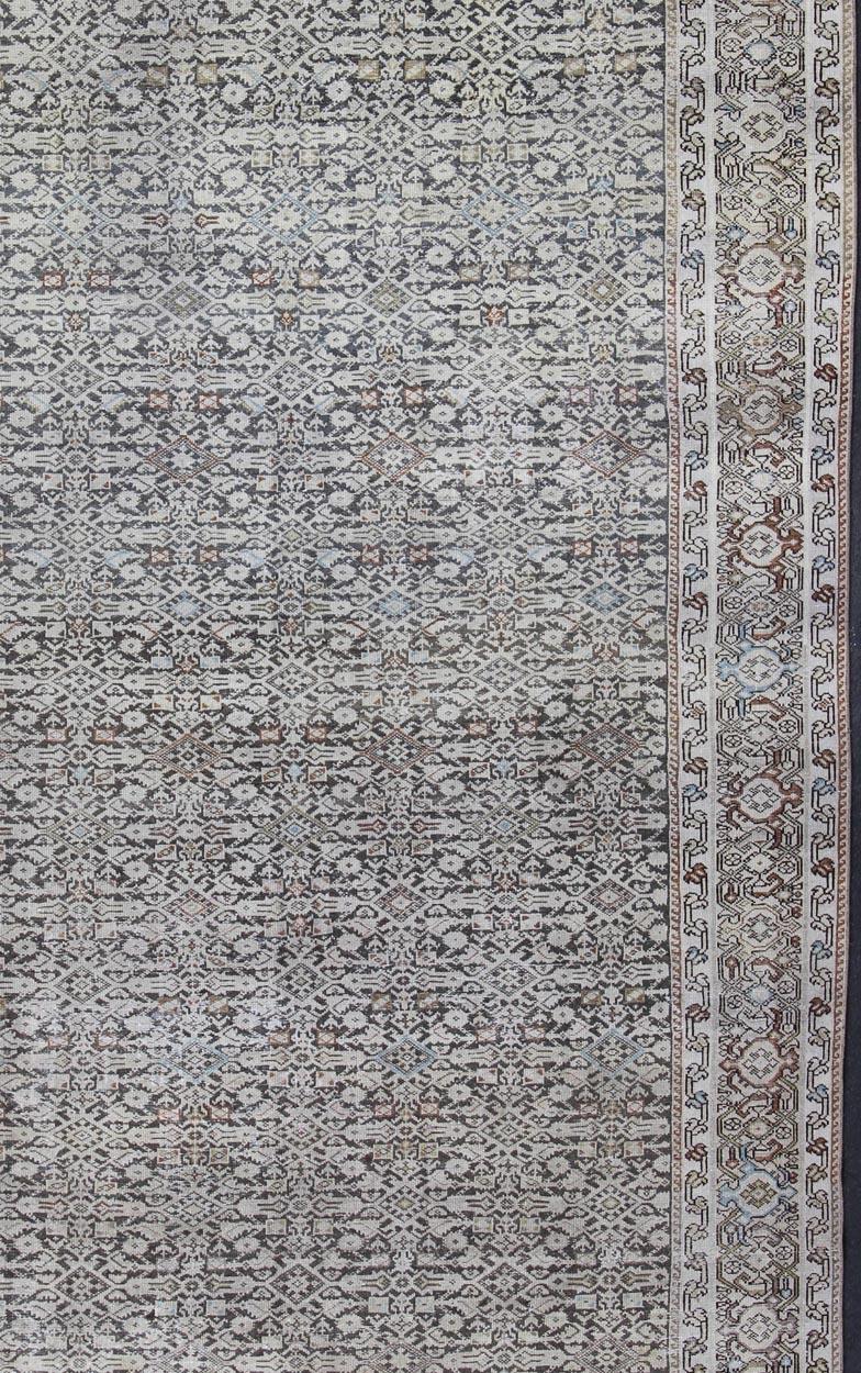 Malayer Antique Rug from Persia with Small-Scale Geometrics, rug SUS-1908-7, country of origin / type: Iran / Malayer, circa 1900.
This antique Distressed Malayer carpet from 1900s Persia features dynamic design and color composition. The