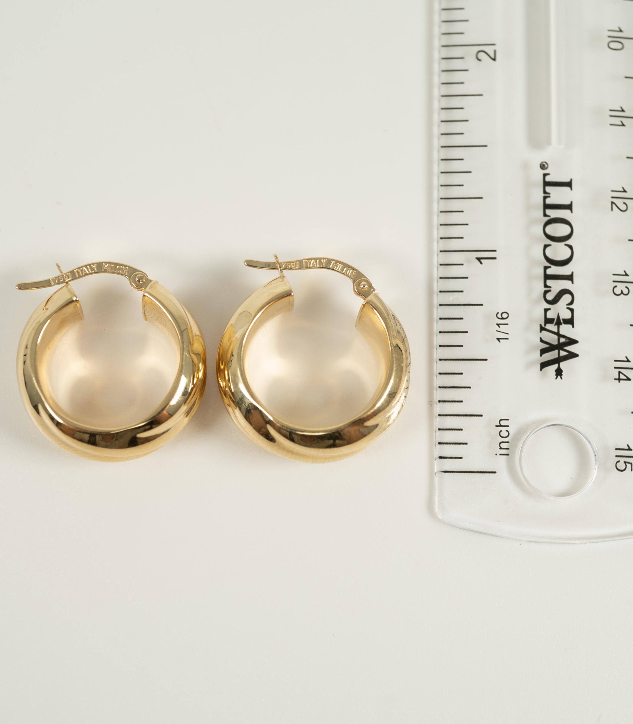 Highly polished and fluted, these 18 karat yellow gold earrings by Milor are a delight on the ear!