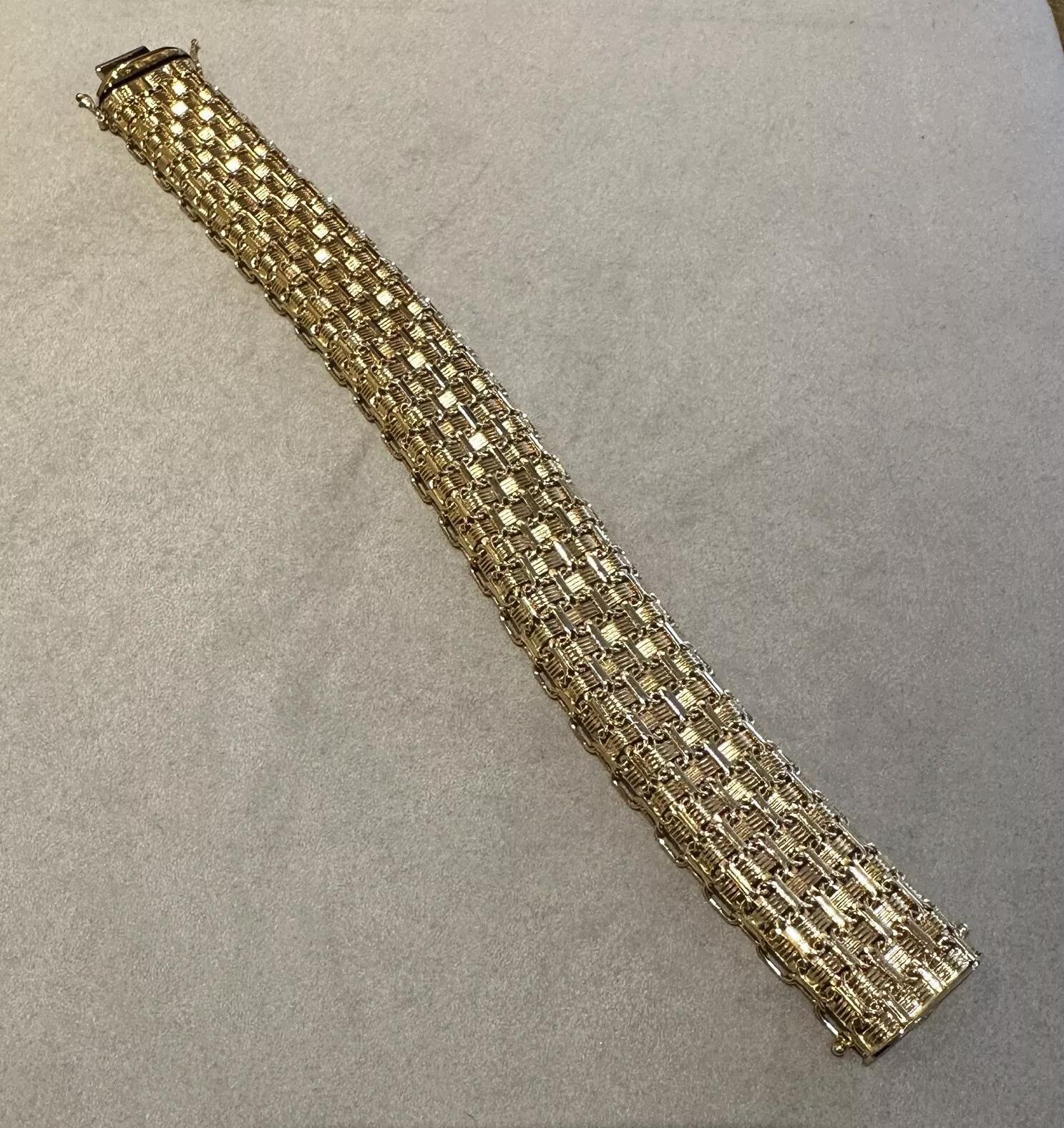 Wide ITALIAN Gold Wave Bracelet in 18k Yellow Gold

Wide Italian Gold Bracelet features Woven links of 18k Yellow Gold with textured links in basketweave design. The bracelet is secured by a tongue clasp with 2 safeties.

Bracelet measures 7.5
