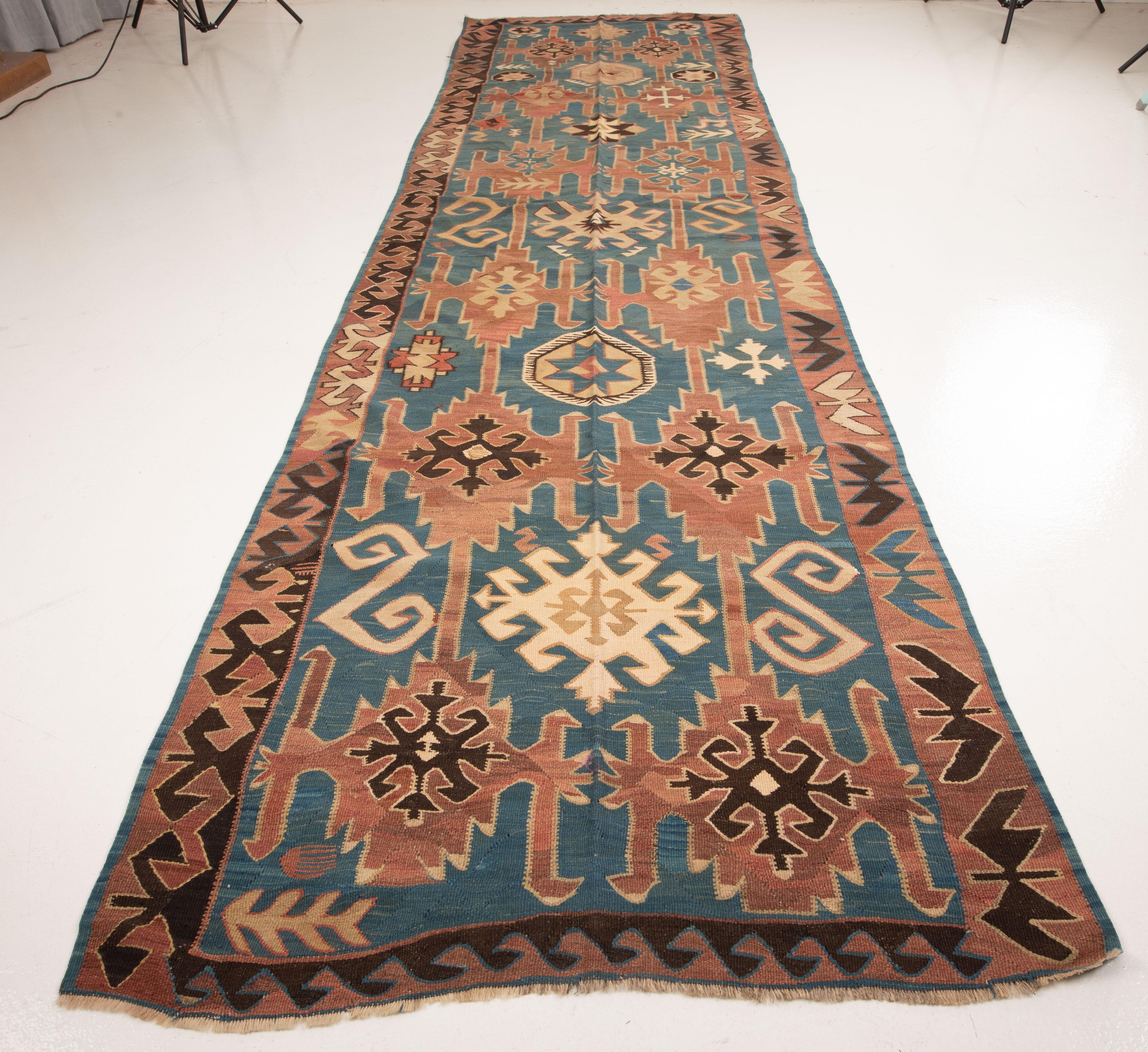 A wide runner kilim with soft blues from Afar peoples of Daghestan in Caucasus.