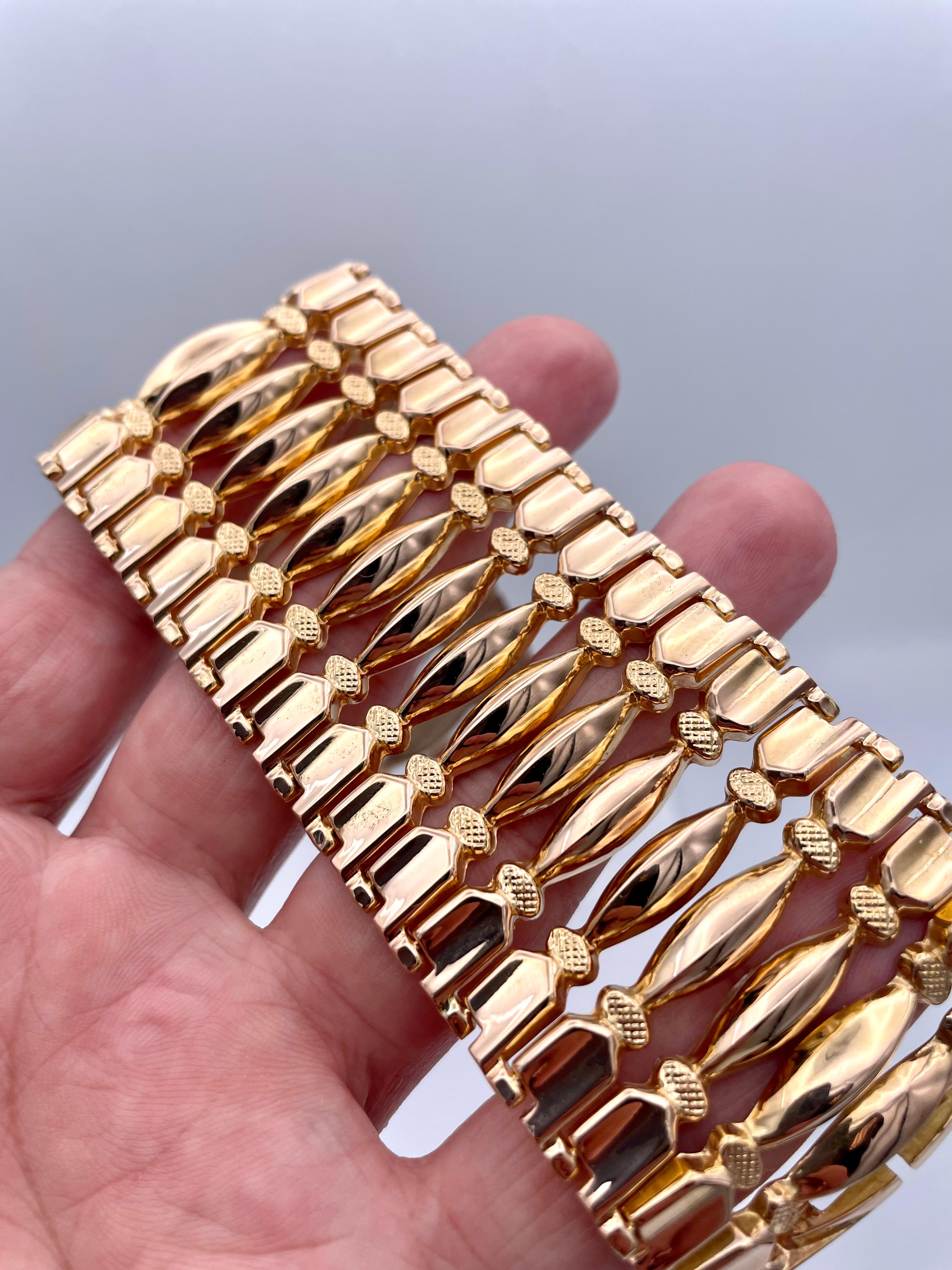 Striking flexible bracelet.  18K yellow gold.  Geometric cut-out pattern.  8