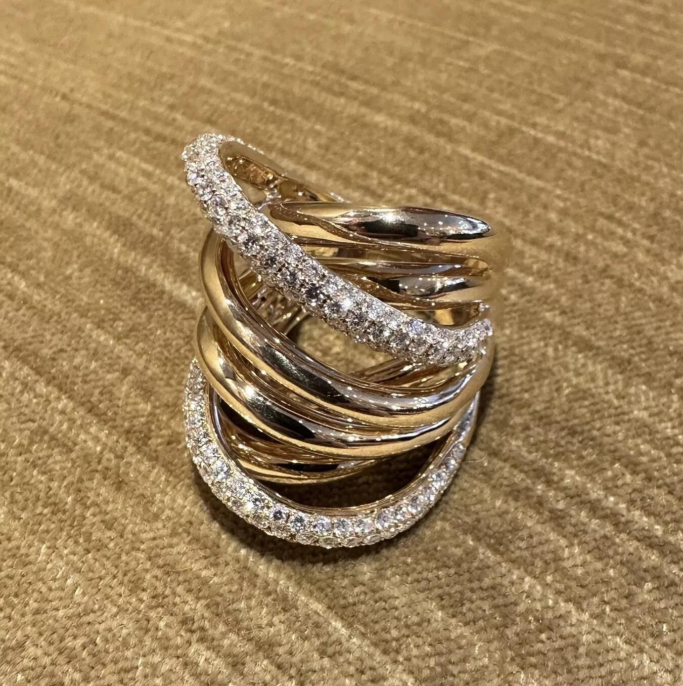 Wide Multi band Crossover Diamond Cocktail Ring in 18k Yellow Gold 

Wide Diamond and Gold Ring features Ribbons of High Polished 18k Yellow Golds with two Ribbons of pave set Natural Round Brilliant Diamonds and six ribbons of gold.

Total diamond