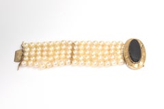 Wide Multi-Strand Cultured Pearl Bracelet with Onyx and Etched Leaf Gold Clasp
