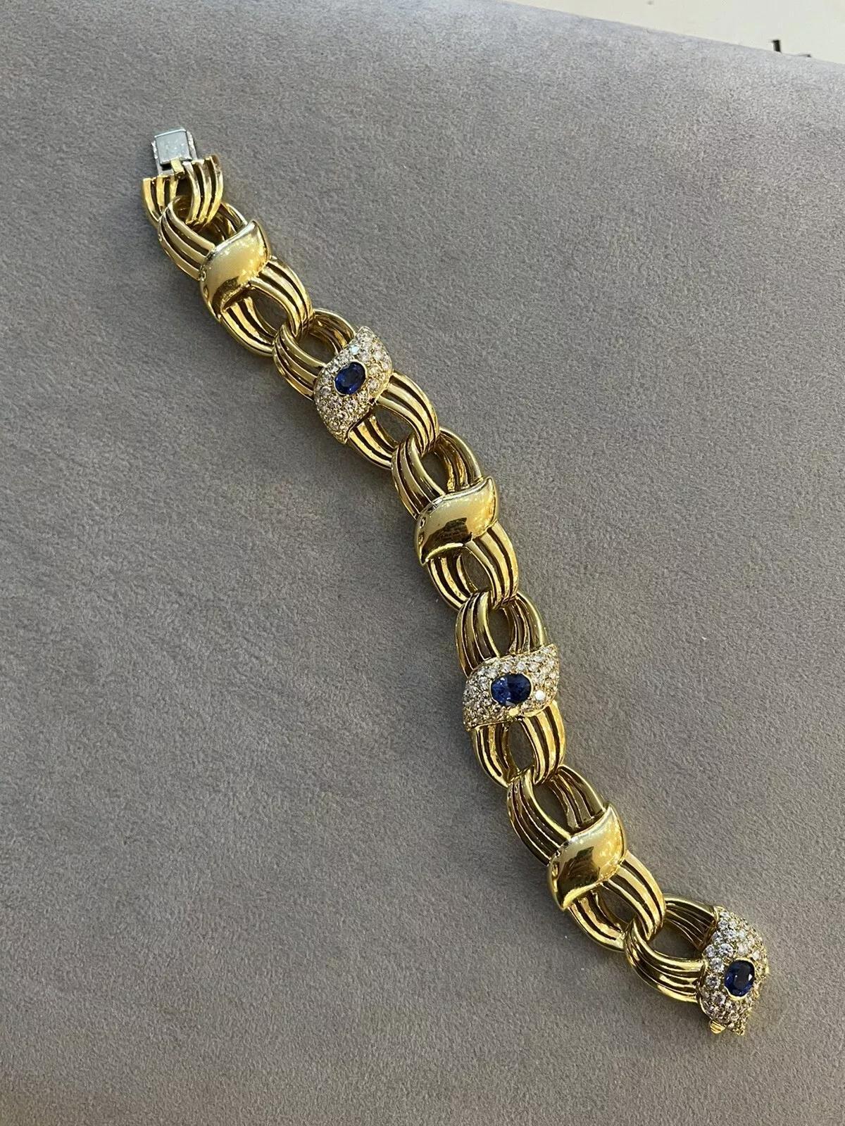 Wide Natural Sapphire and Diamond Link Bracelet in 18k Yellow Gold 

Italian made RCM Sapphire and Diamond Bracelet features Three Diamond and Sapphire stations with Natural Oval Blue Sapphires and Natural Round Brilliant Diamonds, all set in 18k