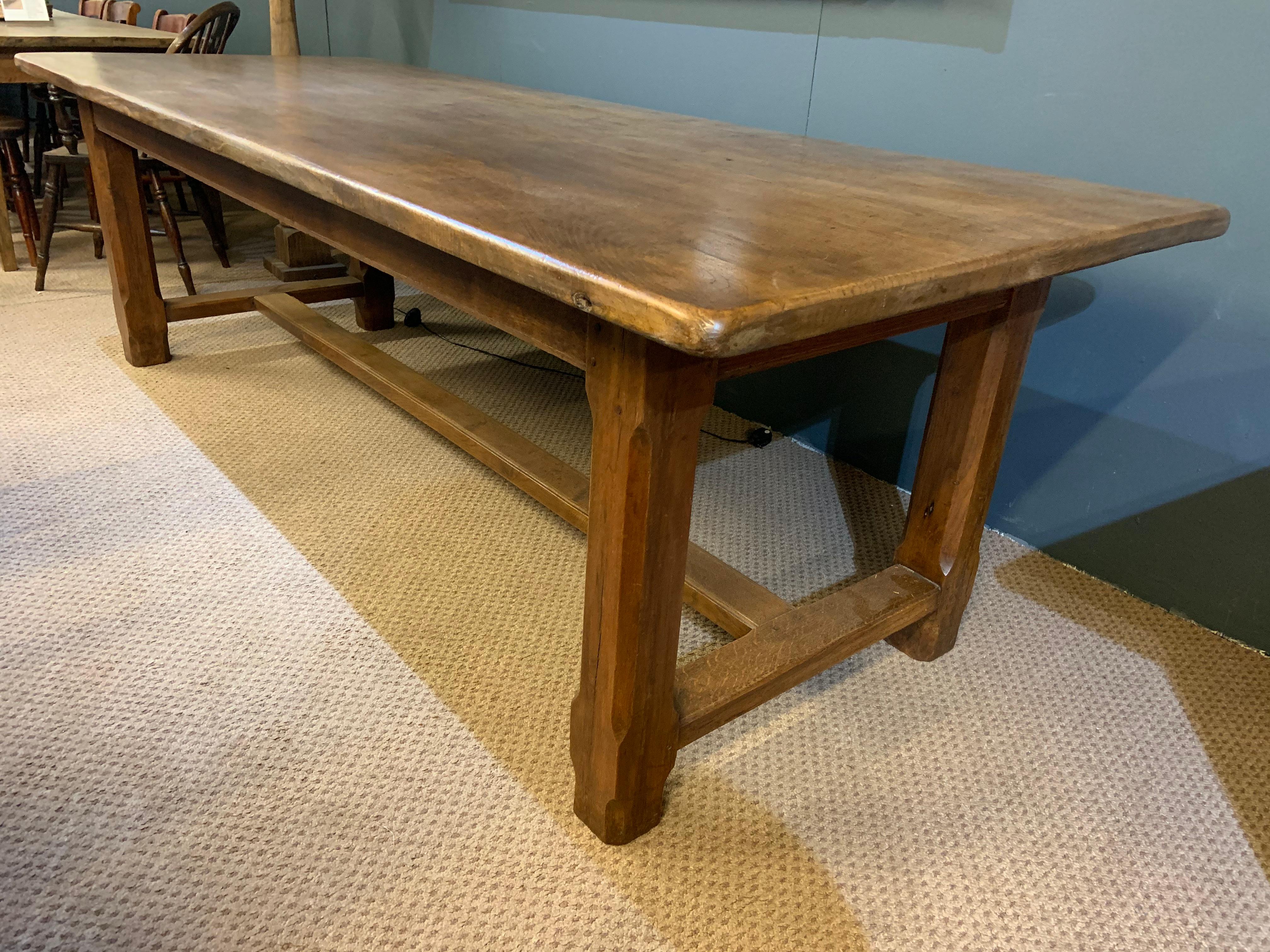 Early 20th century wide oak farmhouse table with centre stretcher. The table has a beautiful wide top and stands on a very sturdy base. Gorgeous colour and patination. Absolutely love this table.  
 