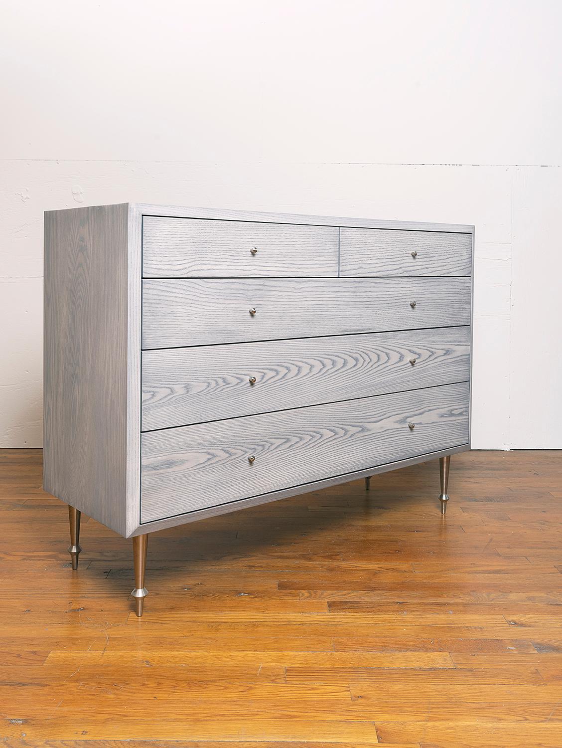 Solid ash with nickel plated legs and drawer pulls.
Greywashed finish.
Dimensions: 48” W x 18” D x 36