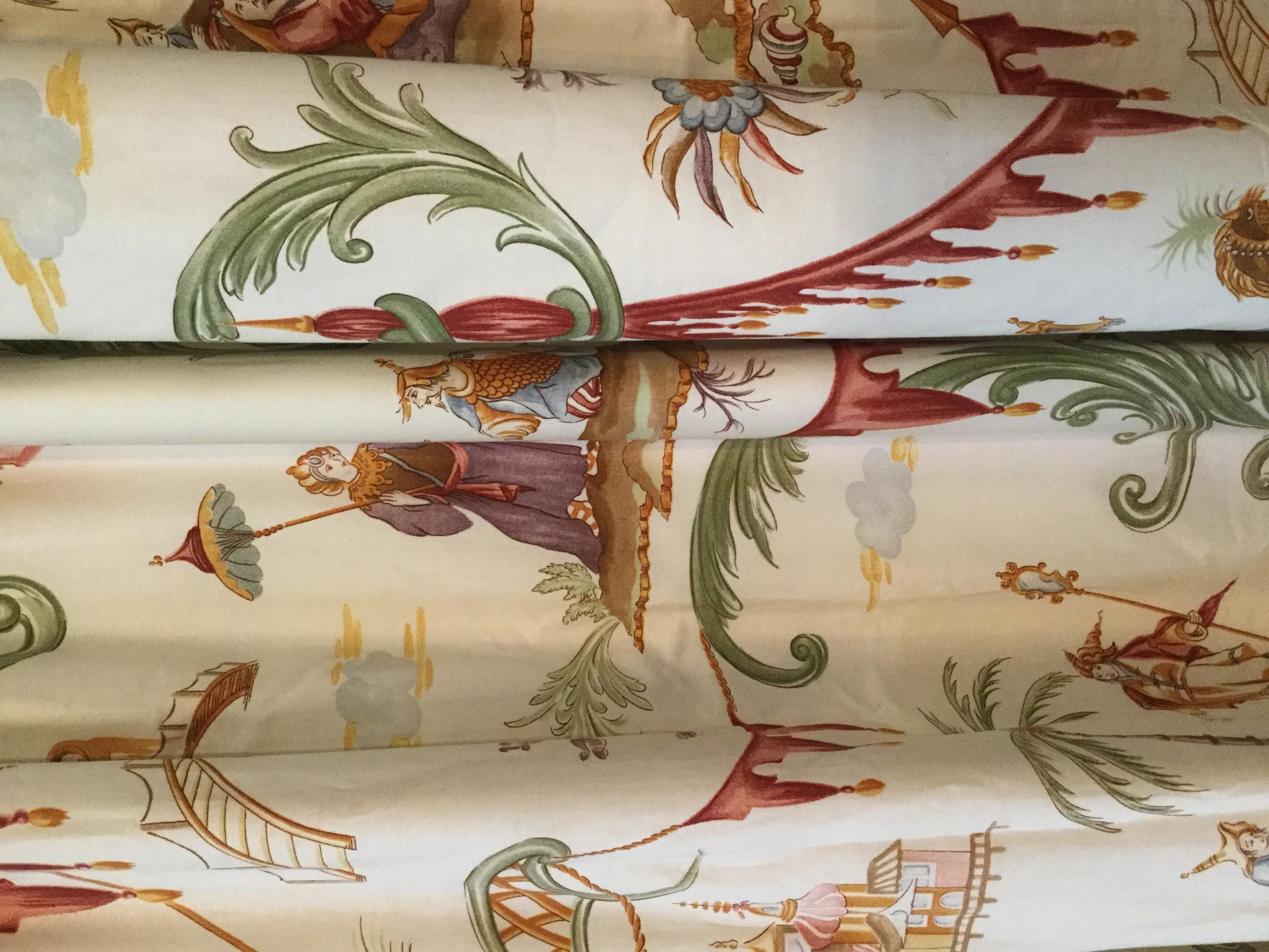 Fabulous pair of Scalamandre toile Drapes. On an off-white background, this whimsical toile pattern depicts a Chinoiseir theme with people, camels, and lots of lush green foliage. There are an abundance of raspberry scrolls, green arabesque, and