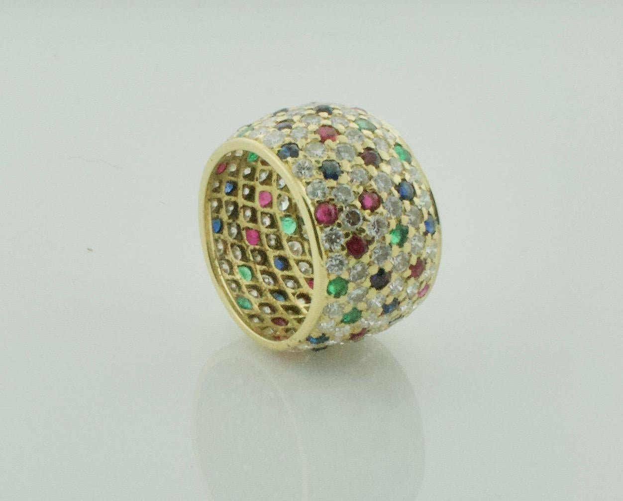 Round Cut Wide Pave' Eternity Band with Diamonds, Sapphires and Rubies in 18k Yellow Gold For Sale