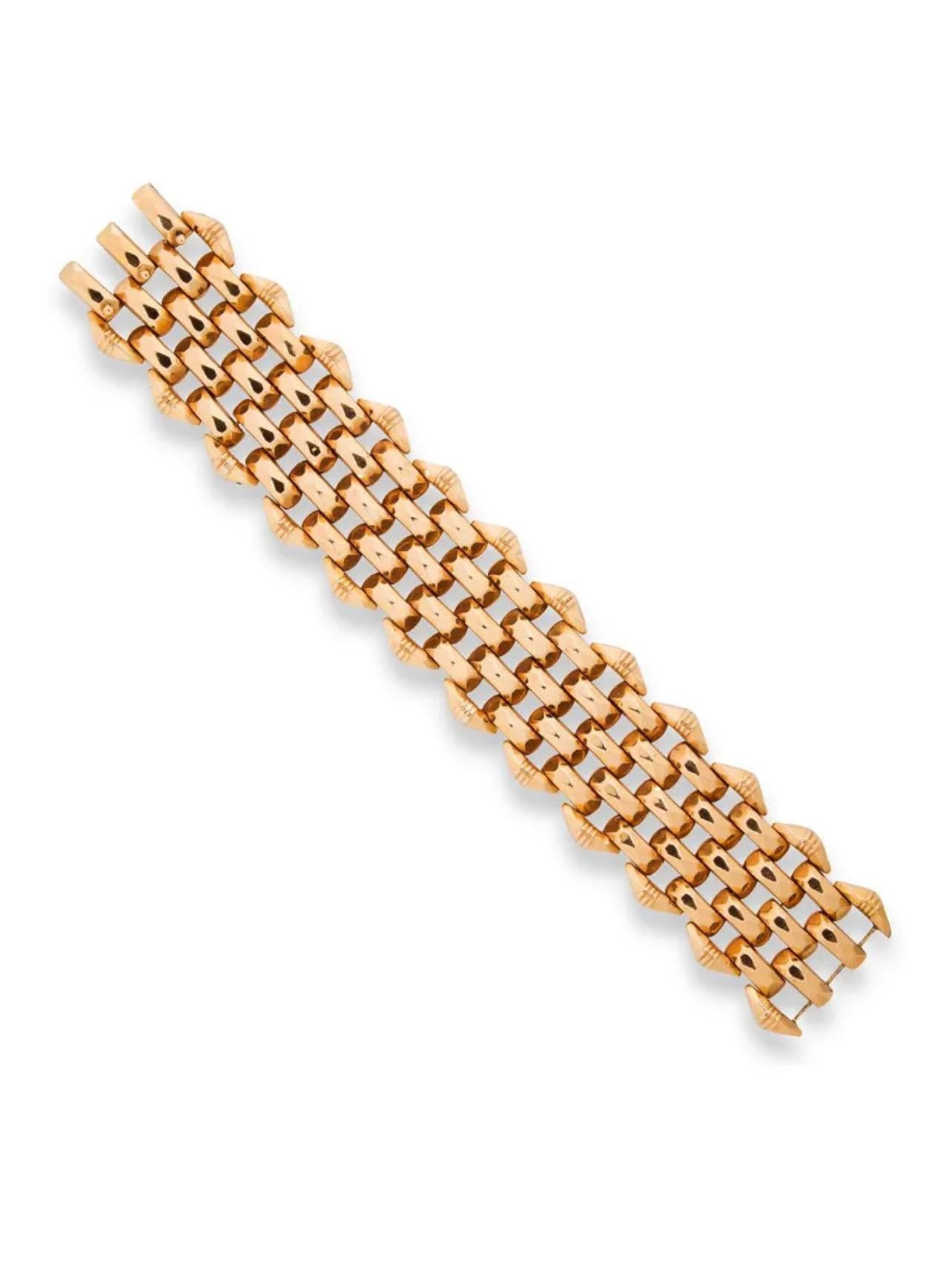 A chic and elegant Retro 18k yellow gold wide tank style bracelet with six rows of faceted links and a triple clasp, Italy, circa 1950. 
The construction of the bracelet in a flexible basketweave design, reminiscent of woven bamboo or rattan. The