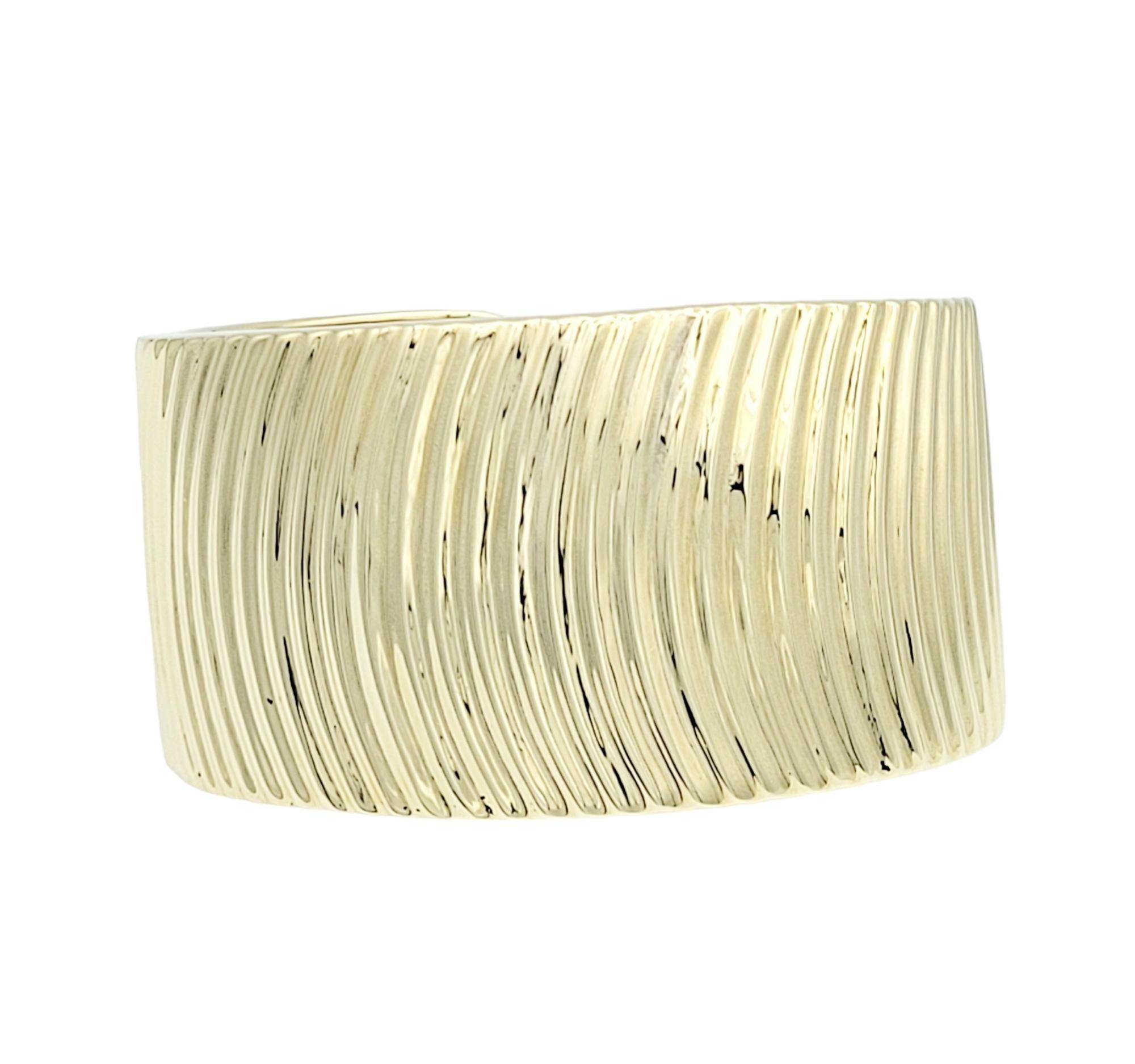 Contemporary Wide Ridged Cuff Bracelet with Hinge Opening in Polished 14 Karat Yellow Gold  For Sale