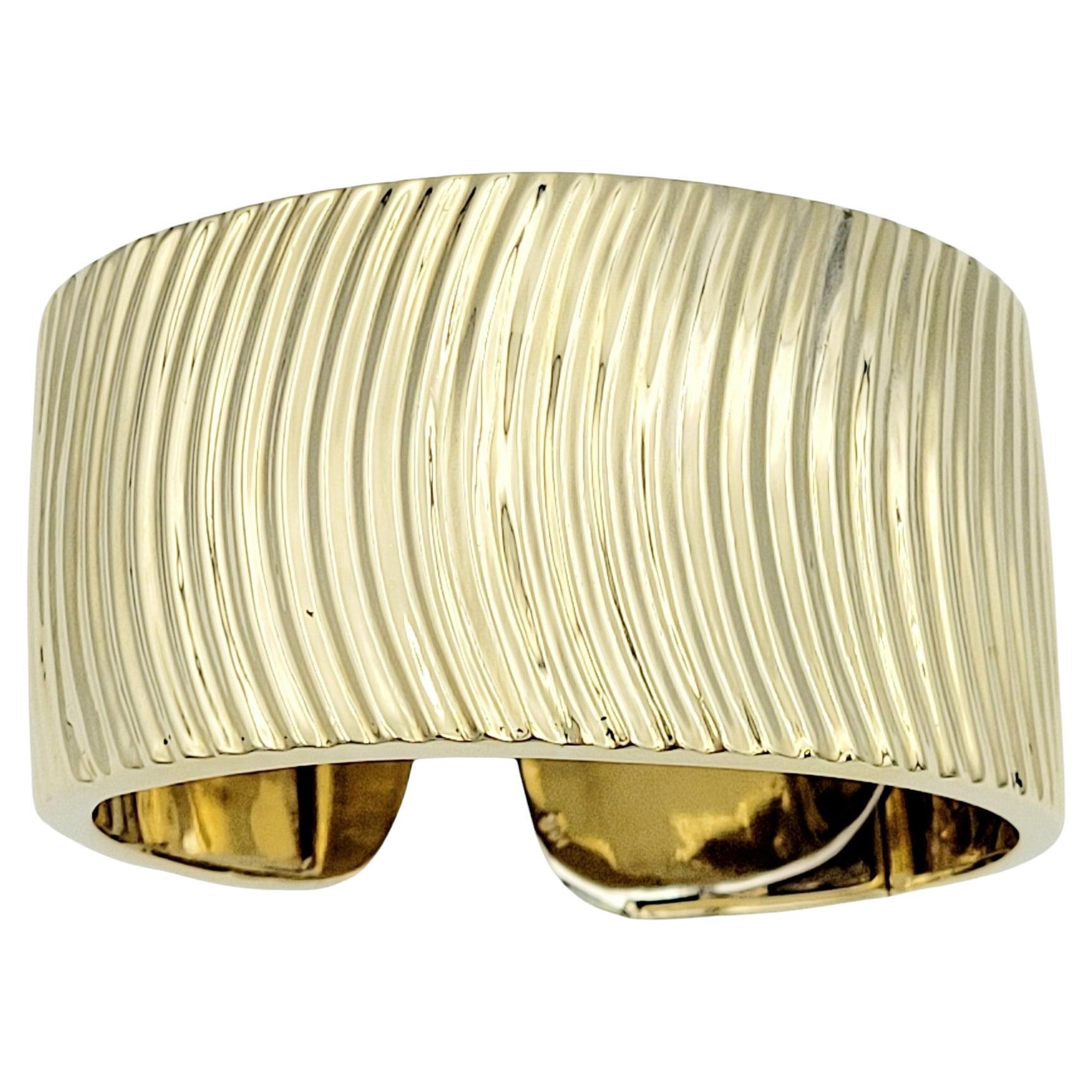 Wide Ridged Cuff Bracelet with Hinge Opening in Polished 14 Karat Yellow Gold  For Sale