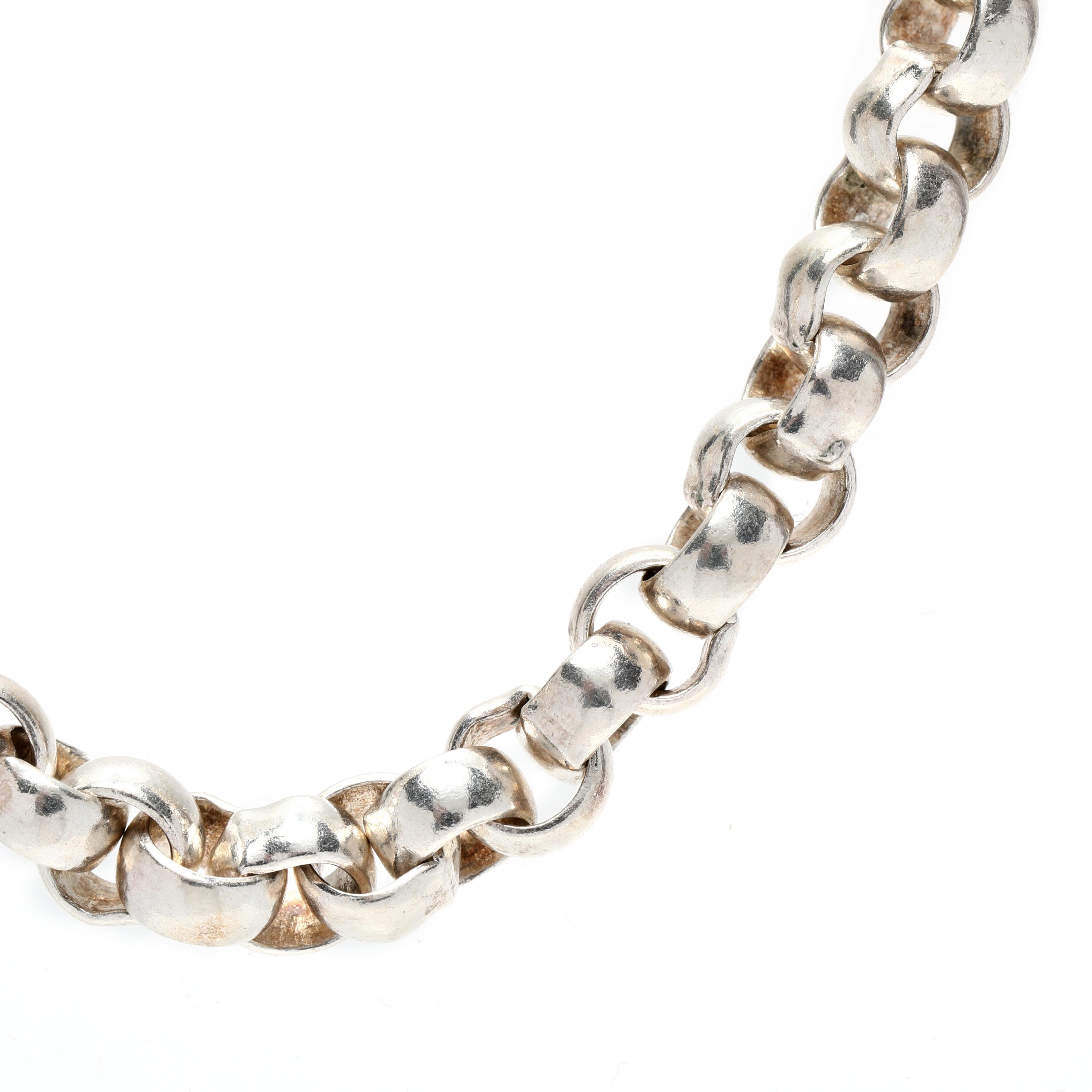 This stunning sterling silver rolo link chain is the perfect accessory. It features a wide rolo link pattern and is finished with a large spring ring clasp. The chain measures 18 inches in length and is made of solid sterling silver. It's a timeless