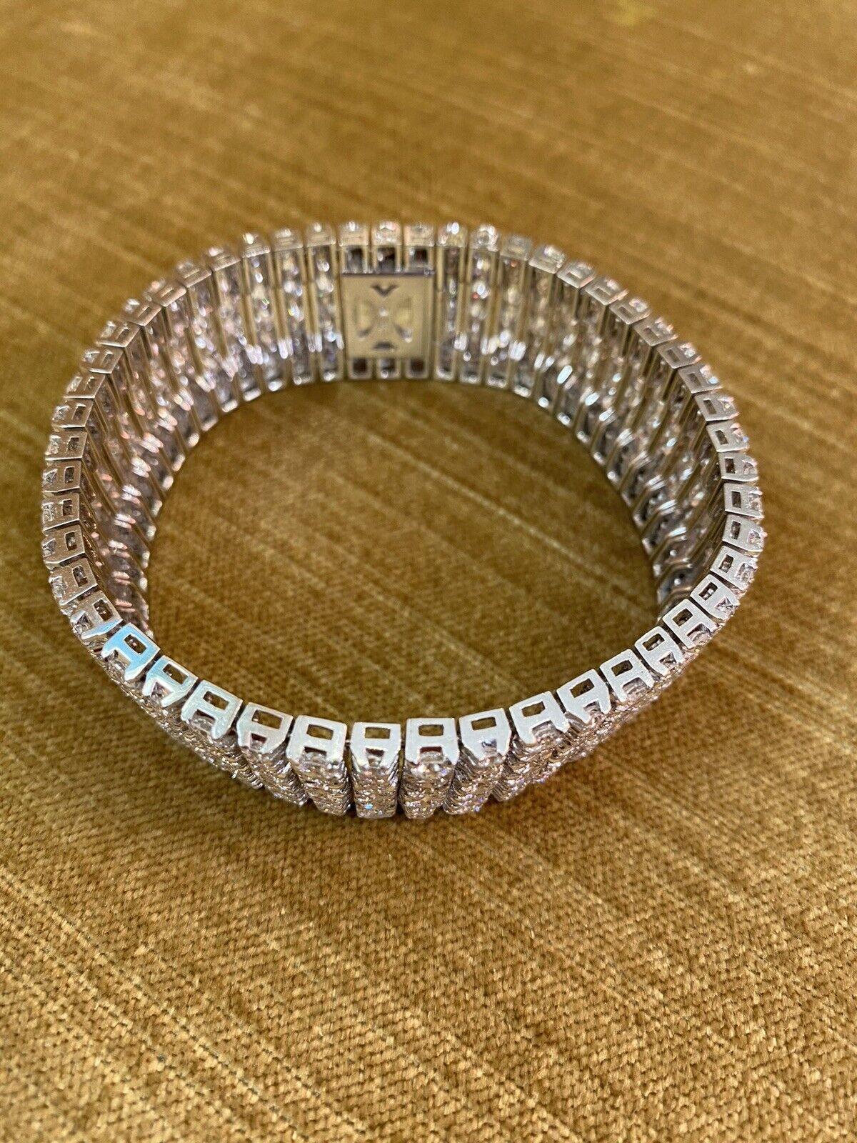 Wide Diamond Statement Bracelet in Platinum by MIKIMOTO
features
50 Rows of Round Brilliant Full cut Diamonds
4 Large/3 Small Diamonds
in alternating pattern
weighing 30.00 carats in total
Diamonds are set in Platinum

Bracelet measures .80 inch