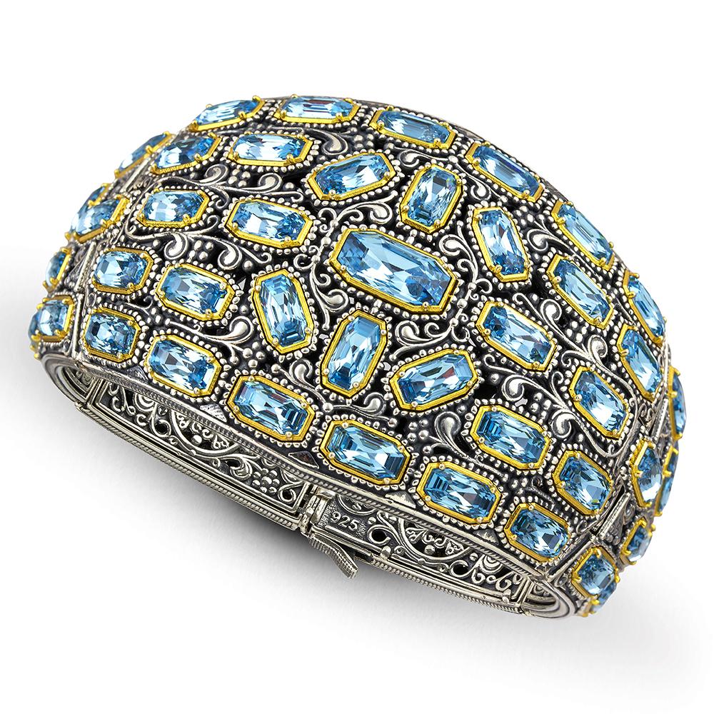 Byzantine style wide bangle bracelet with blue Swarovski crystals handcrafted with passion and love.
Gold plated bezels and intricate patterns embracing the crystals compose a magical piece.
