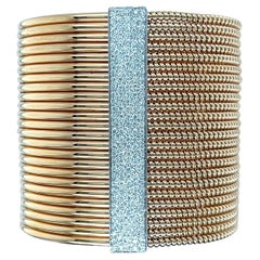 Bracelet manchette large en or bicolore avec diamants Tubogas