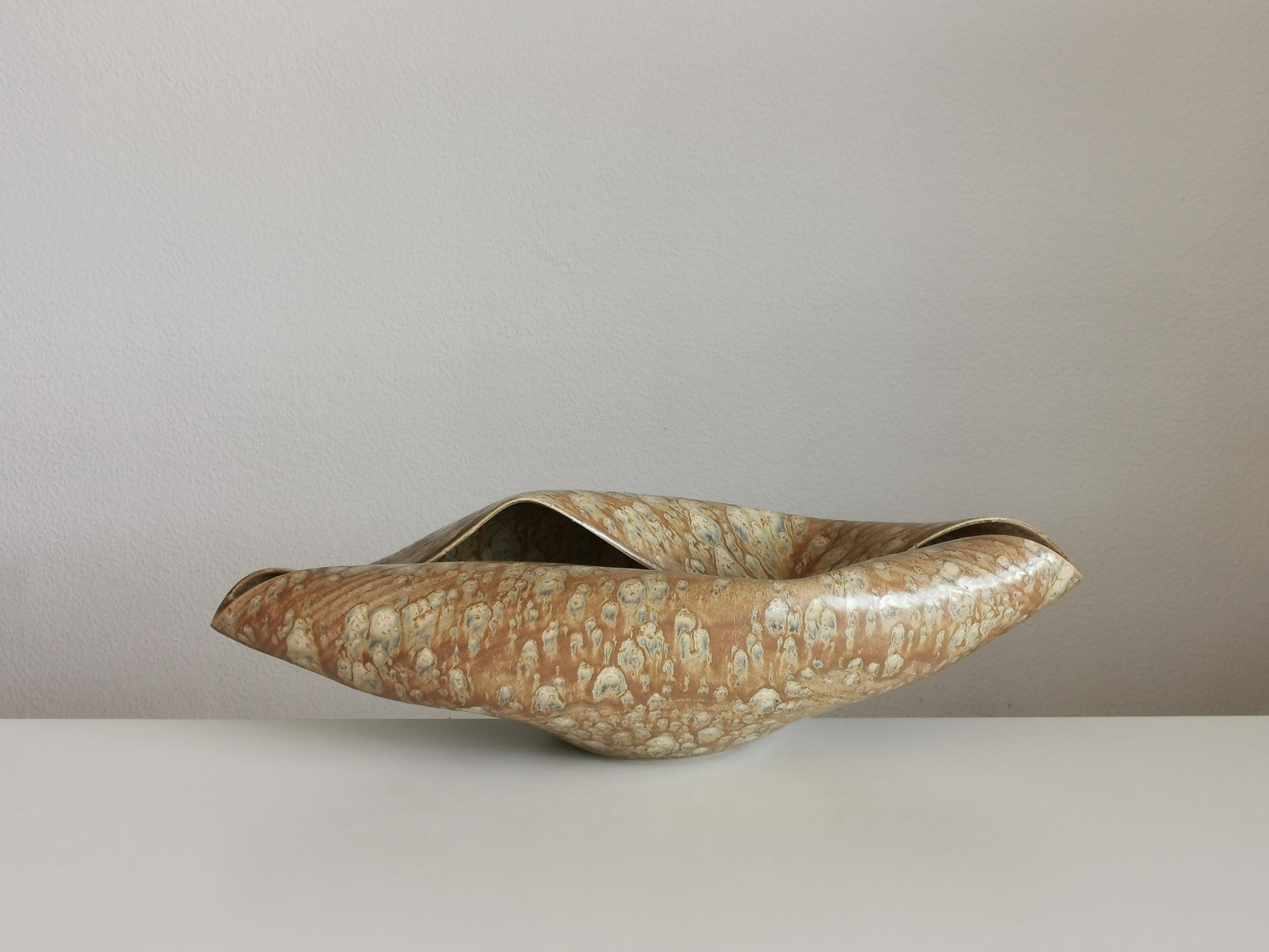 Vessel from ceramic artist Nicholas Arroyave-Portela.

No. 135 Wide undulating open form with a desert dusk glaze (Vessel, Interior sculpture, not suitable for holding water)

White St.Thomas clay, stoneware glazes, multi fired to cone 6 (1223