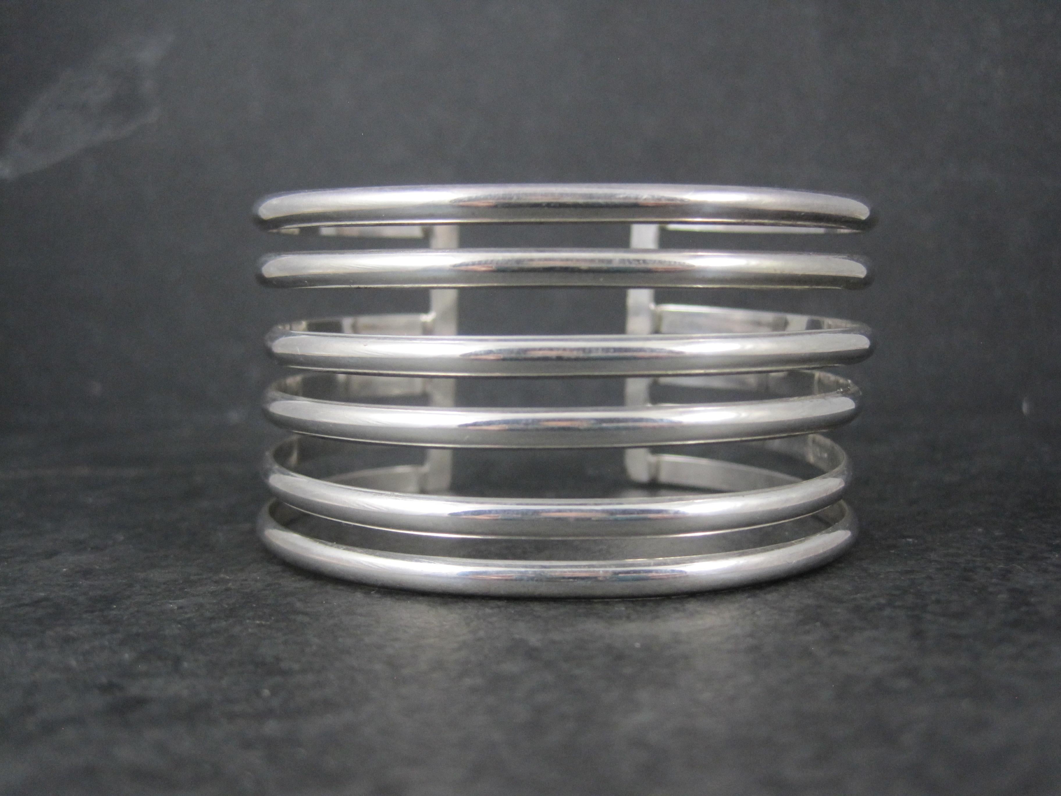 This gorgeous vintage cuff bracelet is sterling silver.
It measures 1 3/8 inches wide. It has an inner circumference of 6 1/2 inches, including the 1 inch gap.
Weight: 40.2 grams
Marks: 925, Mexico
Condition: Excellent