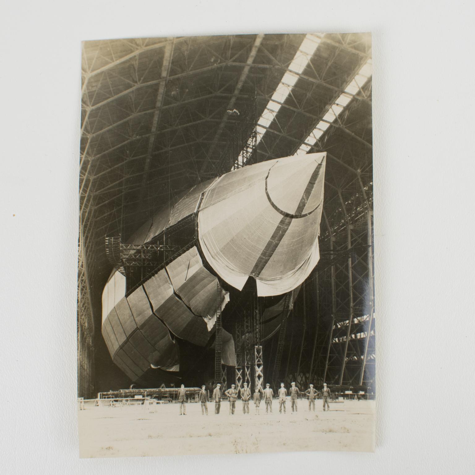 An original silver gelatin black and white photography by Wide World Photos - New York Times Paris, Airship R100 in construction, circa 1929. Note the people in the foreground of the photograph gives a little idea of ​​the airship's