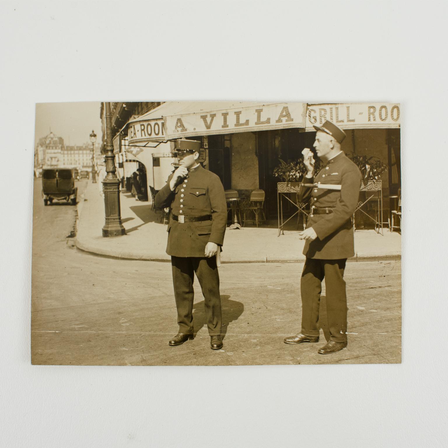 Policemen in Paris circa 1930 - Silver Gelatin Black and White Photography - Brown Figurative Photograph by Wide World Photos