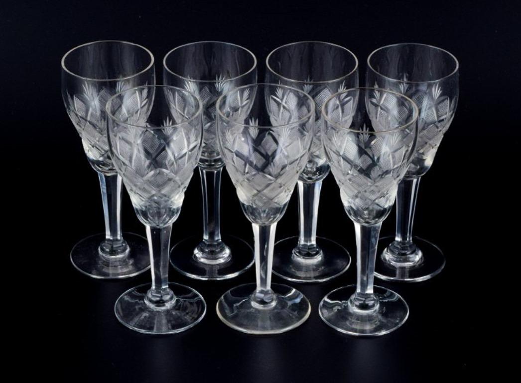Wien Antik, Lyngby Glas, Denmark, vintage set of seven clear port wine glasses.
Faceted stem.
1930s-1940s.
In perfect condition.
Dimensions: H 12.0 x 4.5 cm.