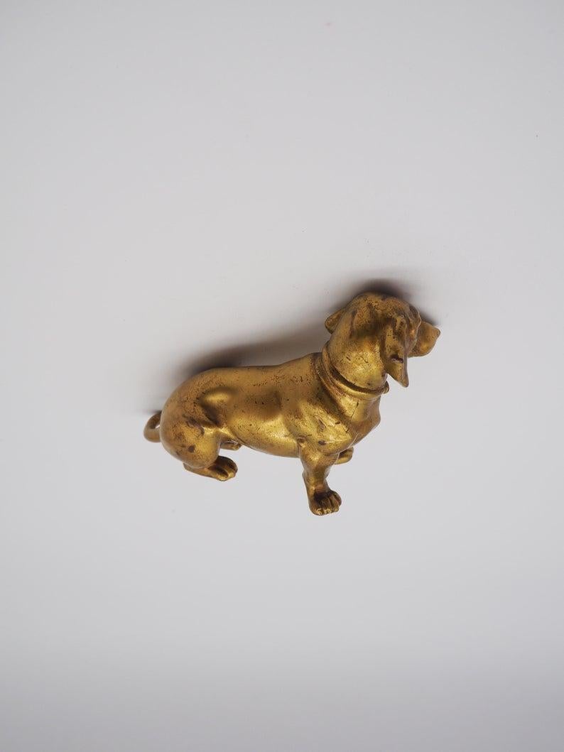A small wiener dog made of bronze in Austria.