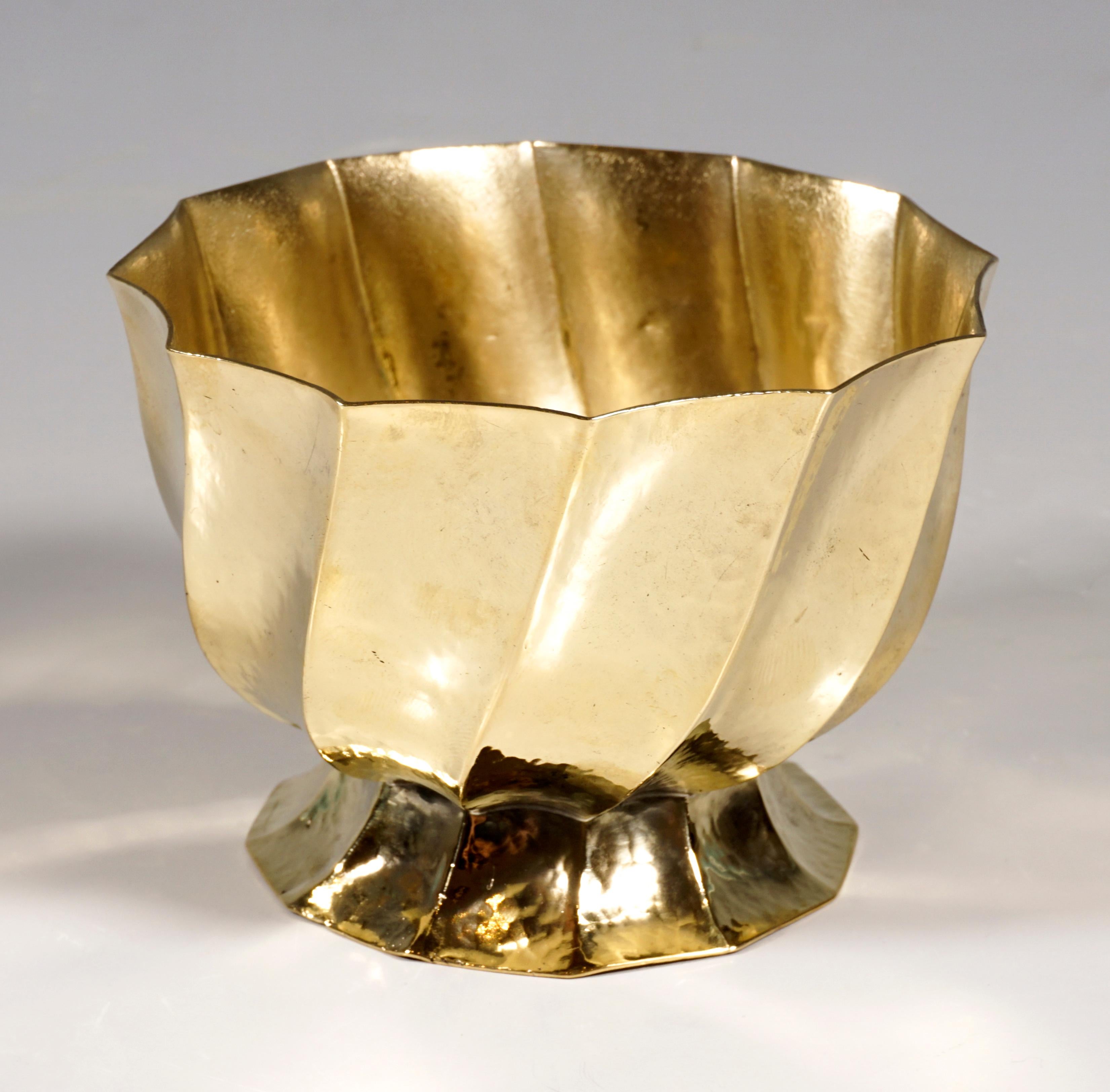 Small cup made of embossed and folded brass with a light hammered decoration. Design of this cigarette holder as part of a smoking set, consisting of serving plate, ashtray, cigarette and cigar holder by Josef Hoffmann, circa 1920.

Manufactory: