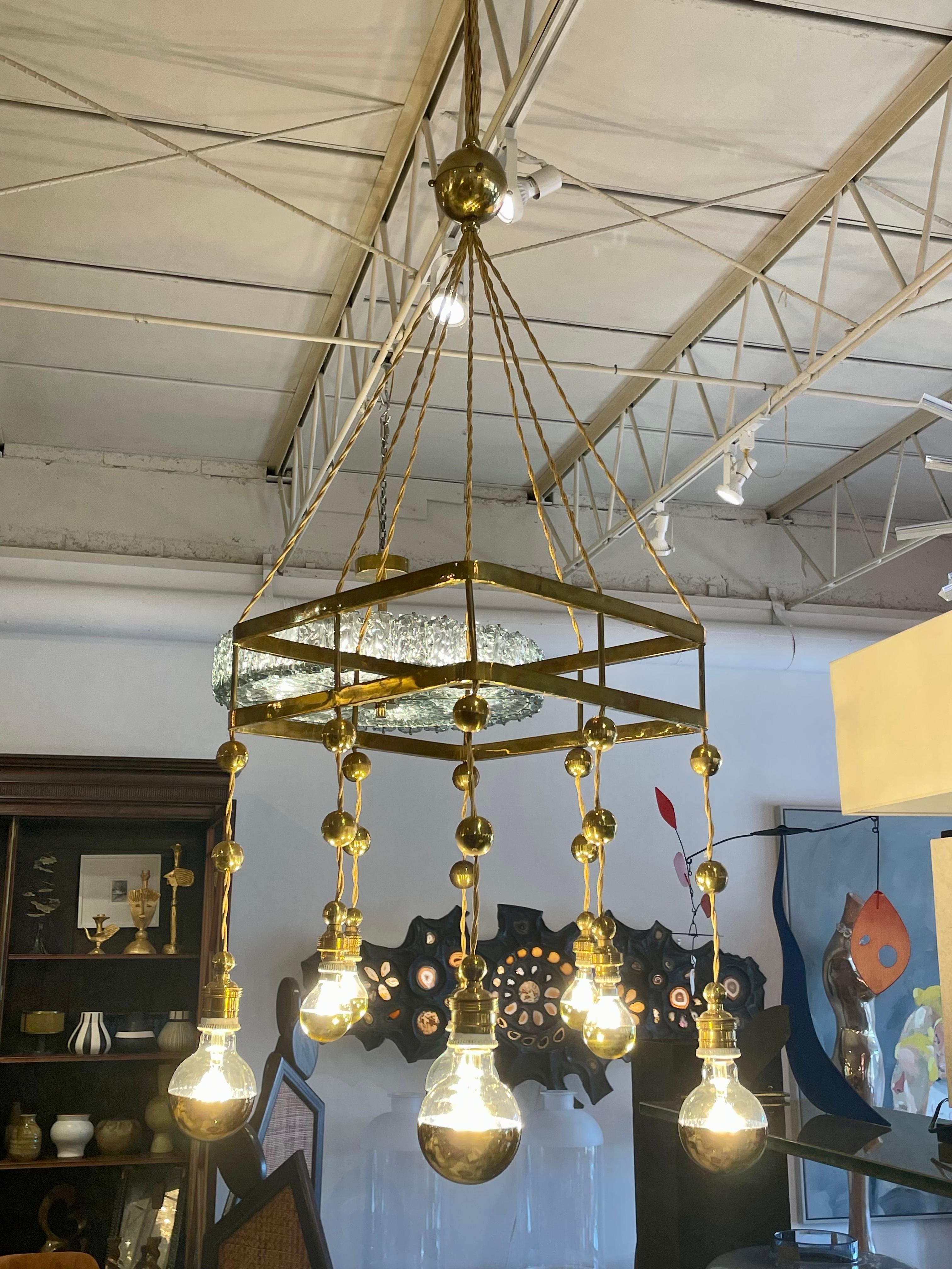 Jugendstil chandelier/ pendant light with 8 sockets from the Vienna Secessionist period - Wiener Werkstätte, Austria. All heavy brass and completely original and well preserved condition. Details abound with brass orbs throughout and link chains. 