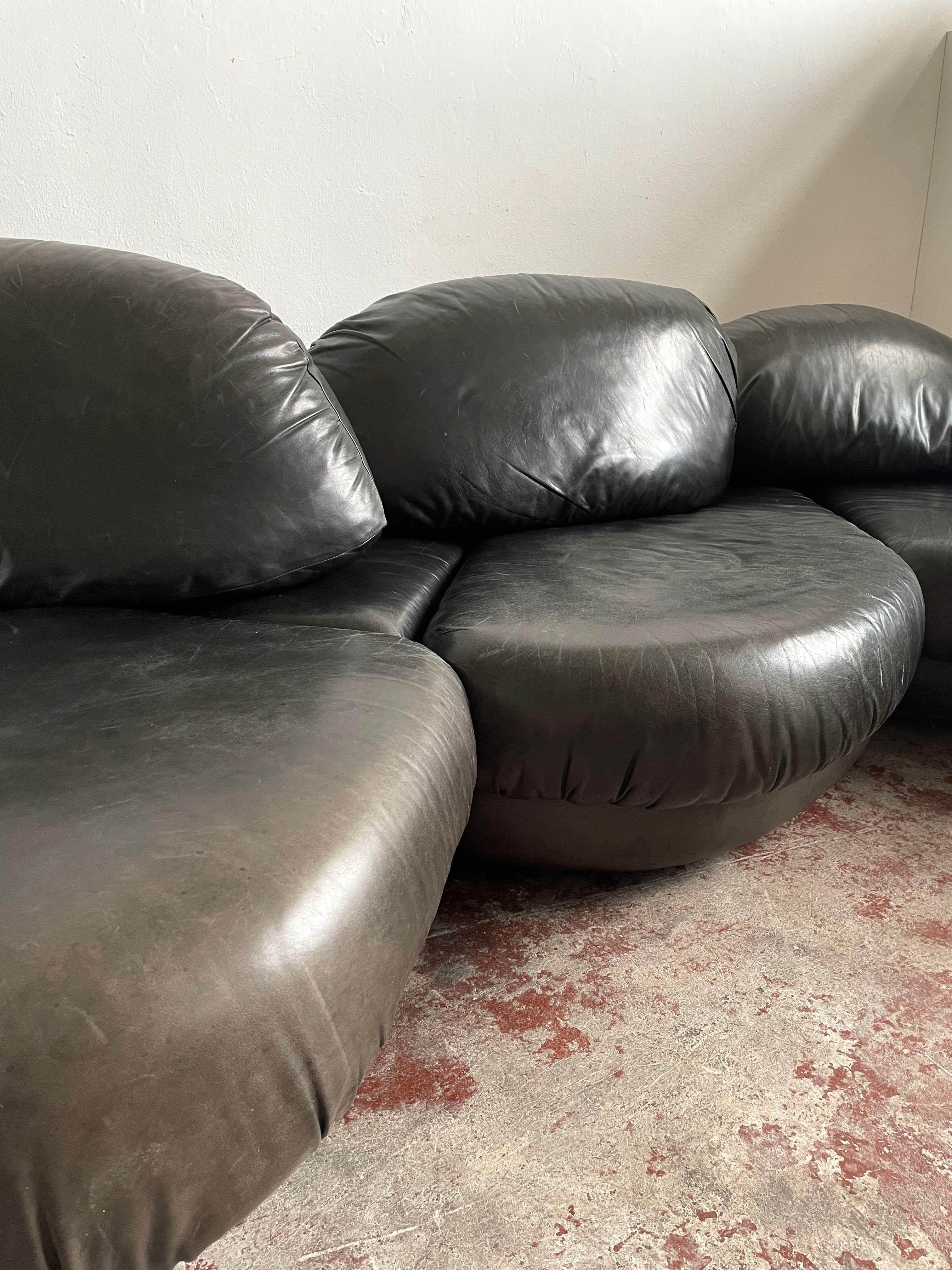 Very rare sectional sofa manufactured in the 1970s by Wiener Werkstätten

The sofa consists of 4 interconnected segments that create a stunning sculptural, organic form, upholstered in soft, silky, top-notch quality black leather in great vintage