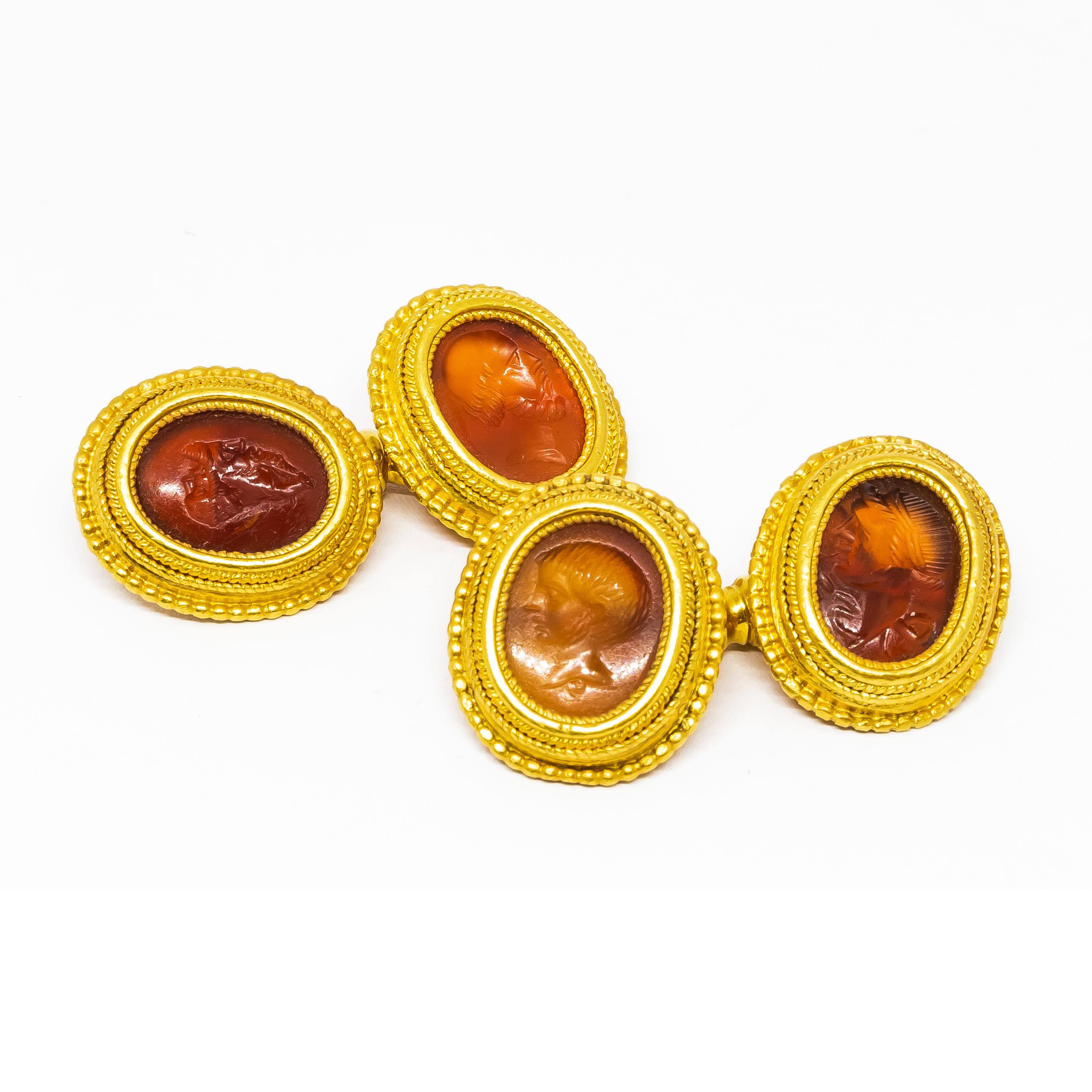 A pair of Wiese, intaglio cufflinks, set with cornelian intaglios, mounted in 18ct gold. The intaglios depict a child's head; the bust of a philosopher; Hygeia, the Greek goddess of hygiene, with a serpent around her neck, this intaglio is dated to