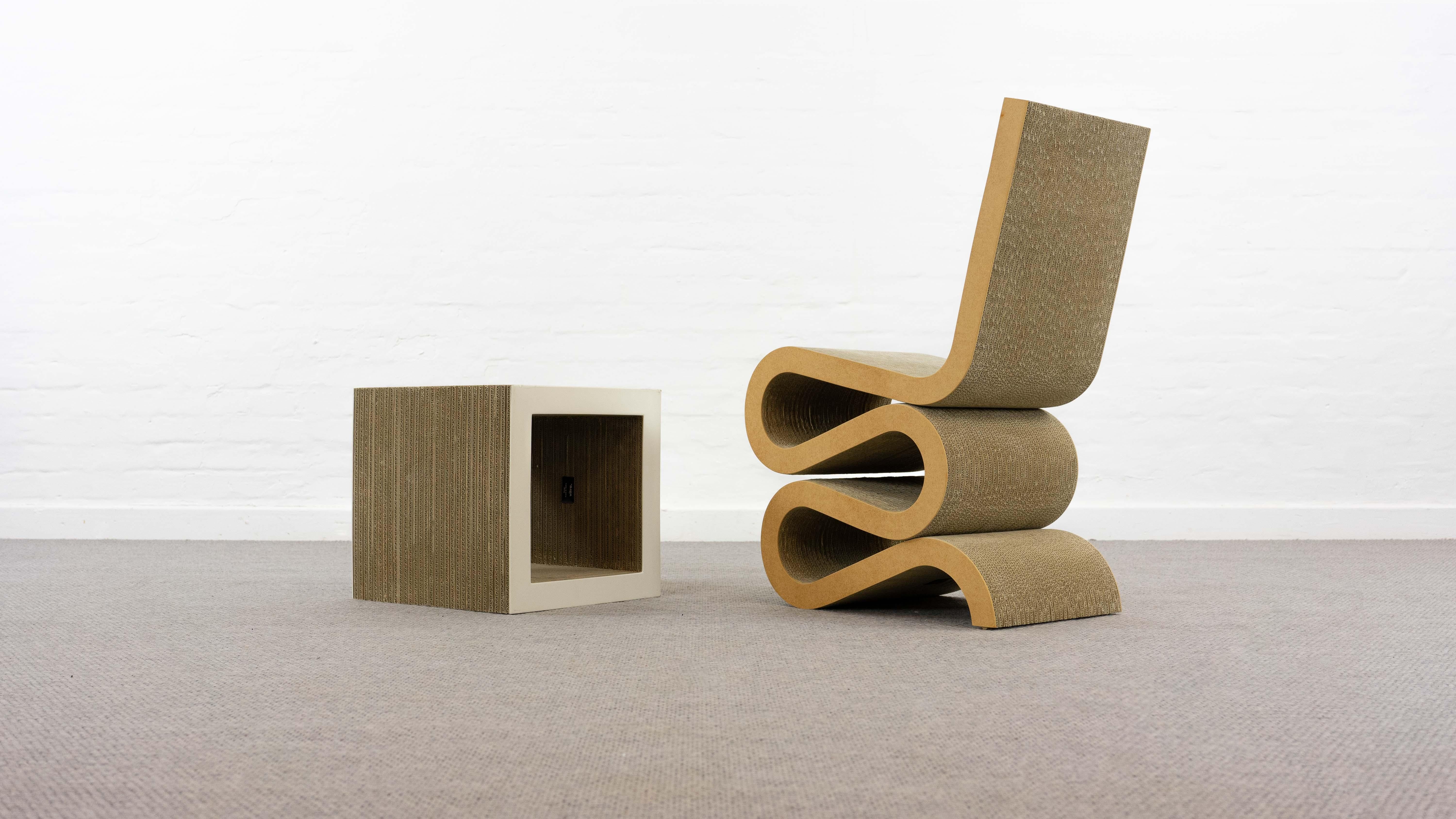 Wiggle chair, designed by the famous Architect Frank O. Gehry 1972. From “Easy Edges ” Series. The main idea was design cheap furniture from a recycleable material Cardboard. After a few month the Production was cancelled. This chair and the table