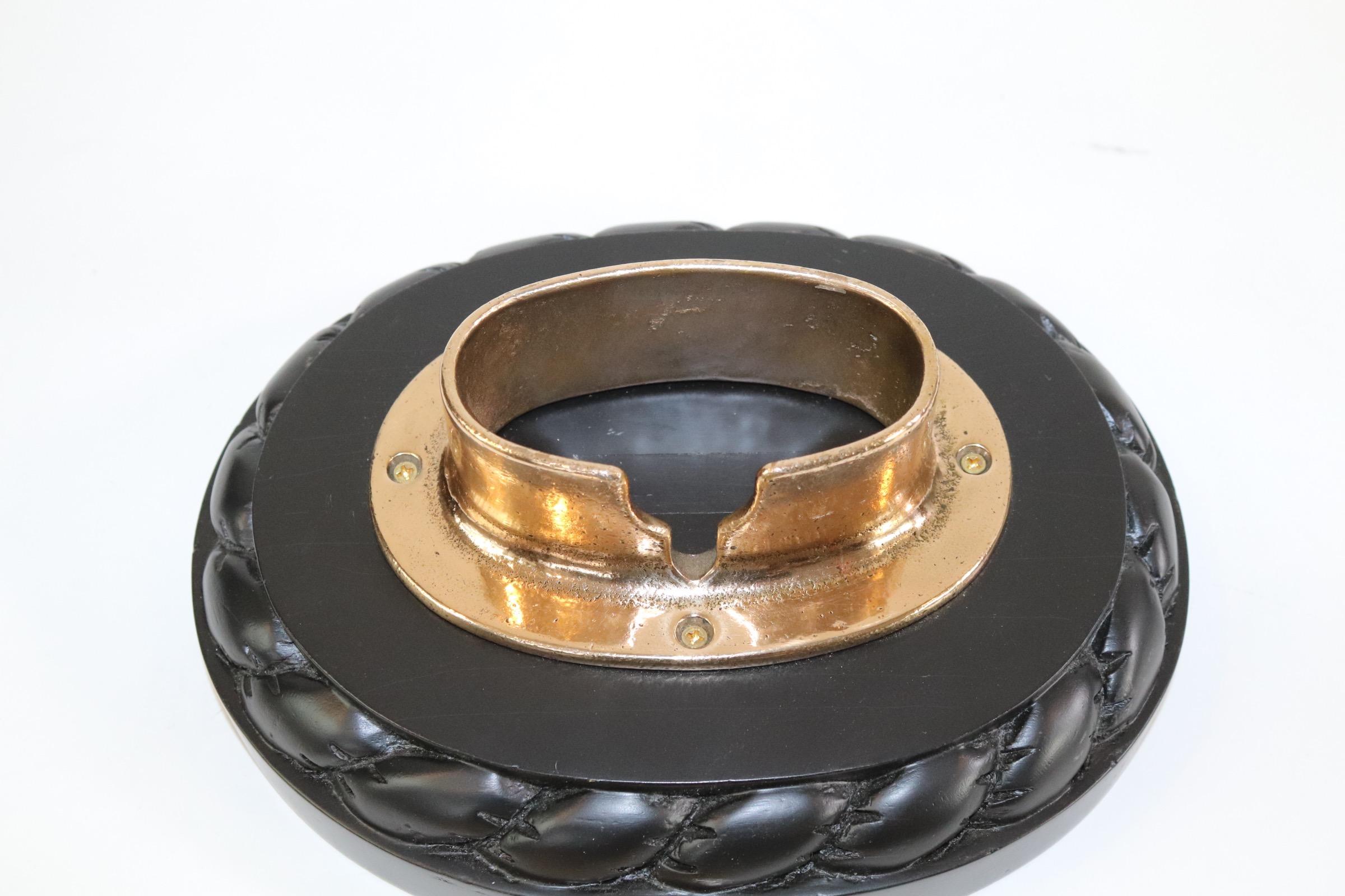 Polished and lacquered solid brass chain housing deck feed with cover. Company hallmark inside lid. Mounted to a thick wood base with carved rope border. Weight is 6 pounds.