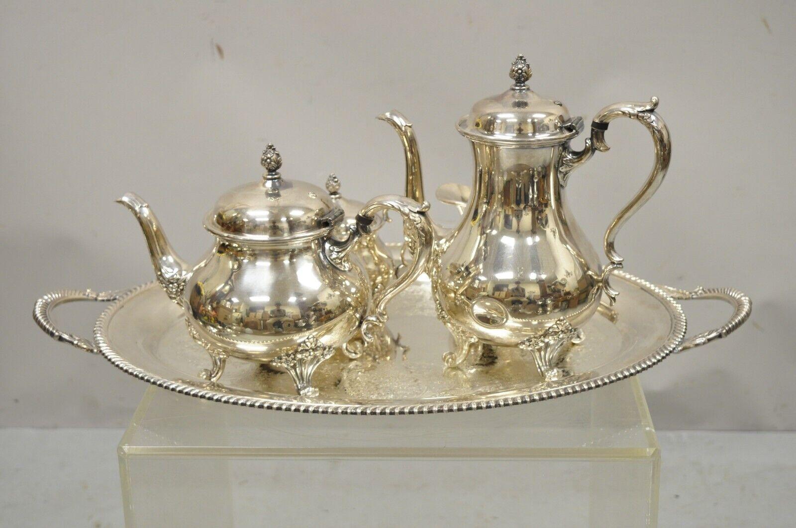 Wilcox International Silver Co Silver plate tea set serving tray and more - 5 pc Set. Item features (1) serving tray, (1) coffee pot, (1) tea pot, (1) creamer, (1) lidded sugar bowl, debossed floral detail, etched platter with scalloped edge,