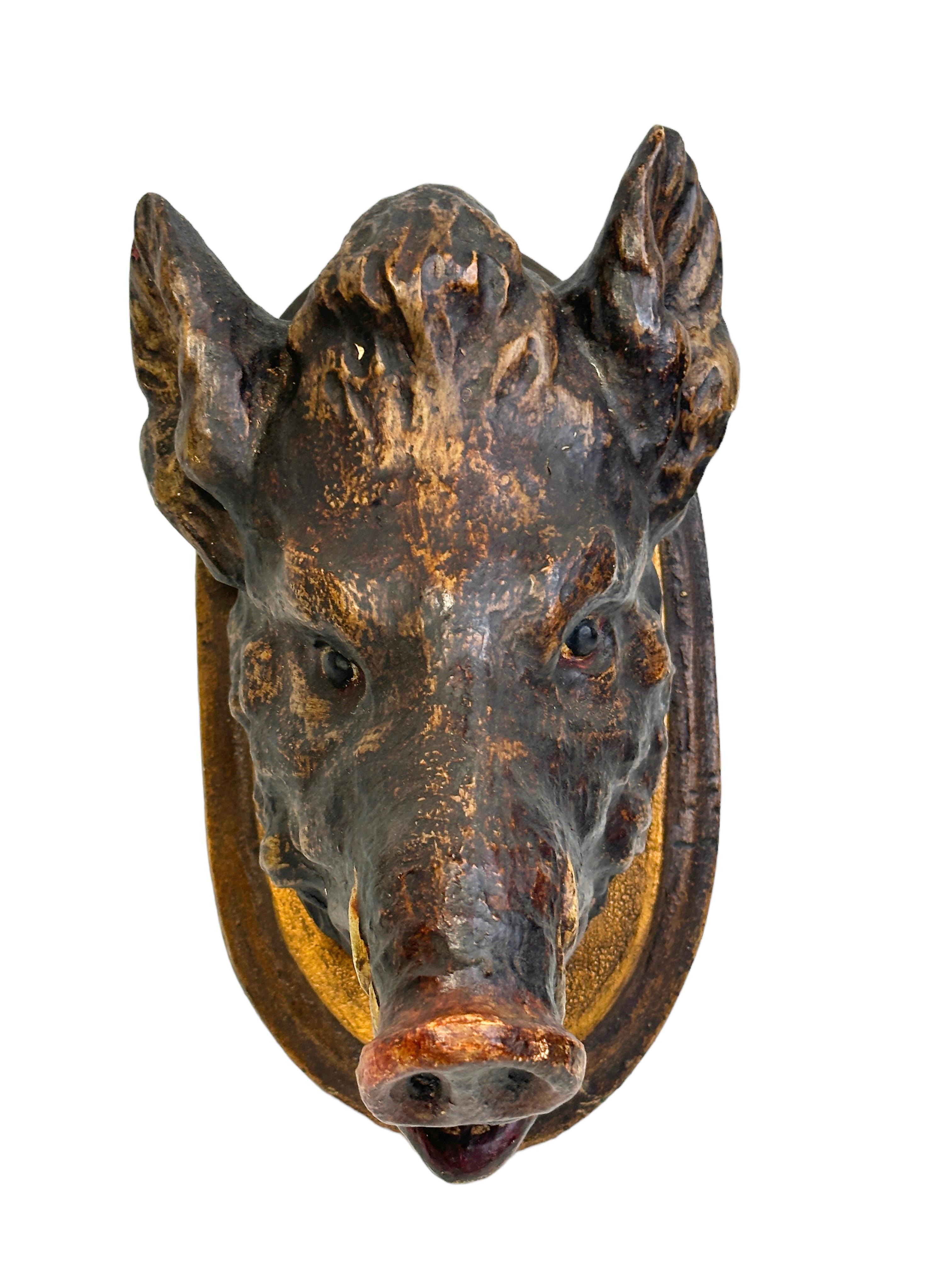 A great looking hand carved original wooden Folk Art Wild Boar head wall decoration. A great piece for a suitable ambiance in a trophy room or the office of a Hunter or Woodsman. More than likely one of the Folk Art items made between 1860 and the