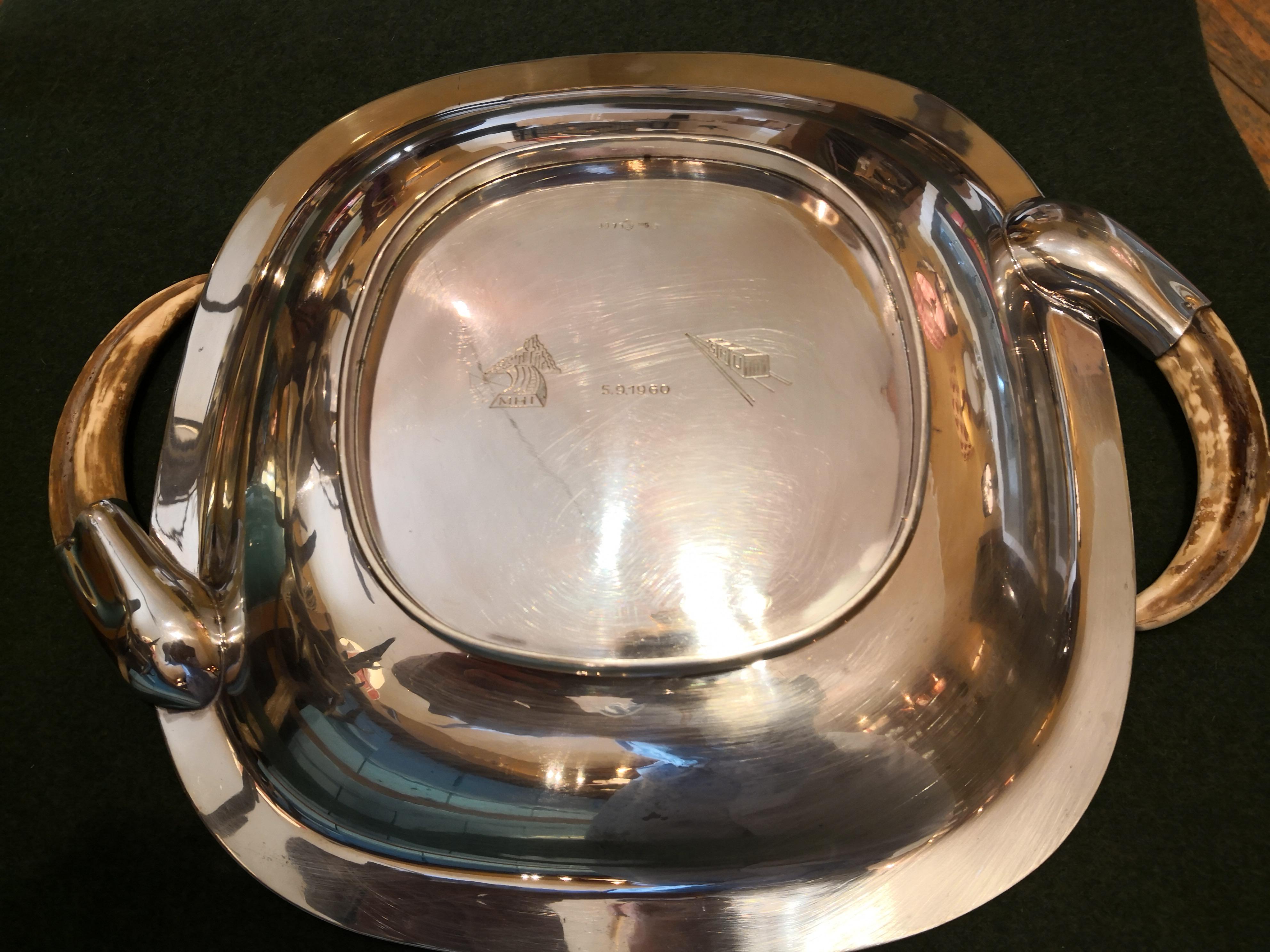 Large rectangular sterling silver dish with curved wild boar handles. The moulded centrepiece is ornamented by a beautiful decorative oak leaf garland all around in the style of black forest. Backside dated 5/ 9/ 1960 with German hallmarks. Stamped